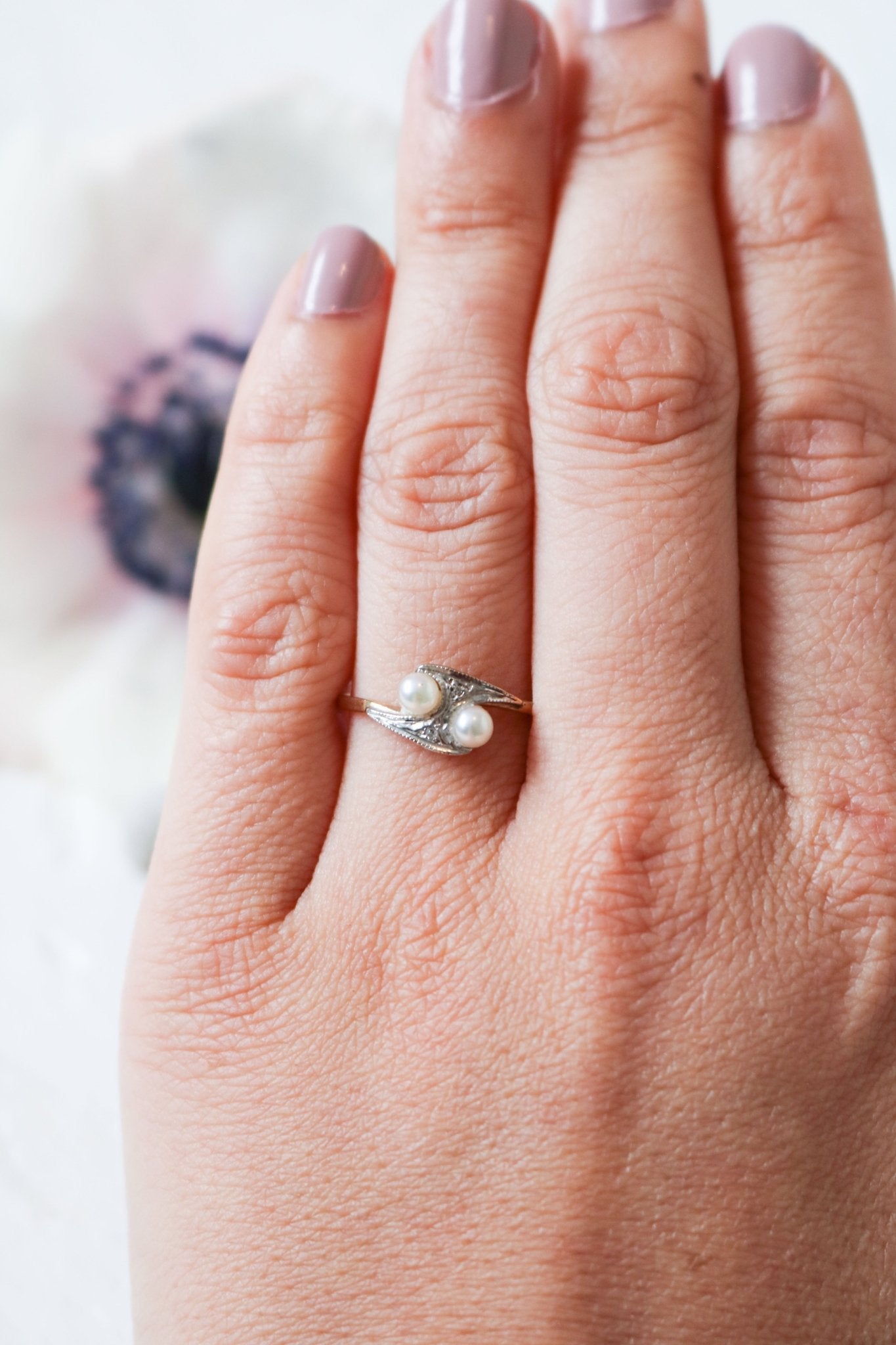 A Double Pearl and Diamond Vintage Engagement Ring in 9k Yellow White Gold 1920 Art Nouveau Style on a ring finger. Antique Engagement Rings Canada. Canadian vintage engagement rings. Vintage engagement rings Canada. Bridal jewelry Canada. Canadian weddings. Wedding Canada. Canadian jewelry brands. Affordable Canadian jewelry brands. Canadian bridal jewelry. Woman-owned Canadian jewelry brand. Pearl jewelry Canada. Pearl Bridal jewelry Canada. Organic pearl jewelry.