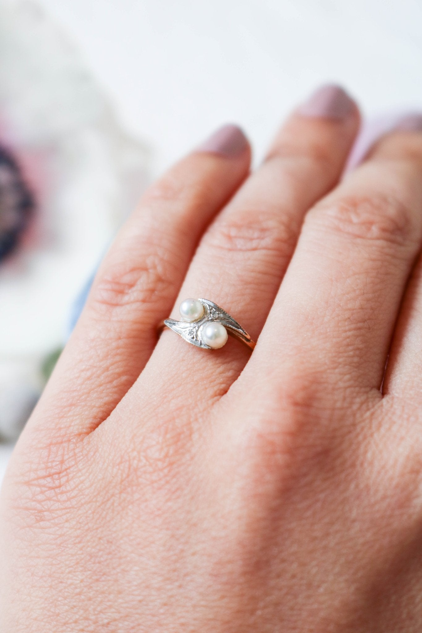A Vintage Engagmenet ring with two pearls and diamond-encrusted band. Antique Engagement Rings Canada. Canadian vintage engagement rings. Vintage engagement rings Canada. Bridal jewelry Canada. Canadian weddings. Wedding Canada. Canadian jewelry brands. Affordable Canadian jewelry brands. Canadian bridal jewelry. Woman-owned Canadian jewelry brand. Pearl jewelry Canada. Pearl Bridal jewelry Canada. Organic pearl jewelry.