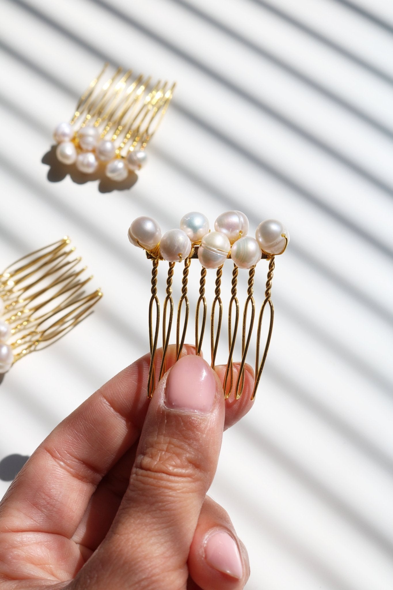 Adelle Pearl Comb no.03 in gold with large freshwater pearls for wedding accessories. Affordable Canadian jewelry brands. Handmade Canadian jewelry. Canadian jewelry business. Organic pearl jewelry. Pearl jewelry sets. Bridal jewelry Canada. Pearl jewelry Canada. Pearl Bridal jewelry Canada. Canadian jewelry designer. Canadian jewelry designs. Pearl Hair Accessories.