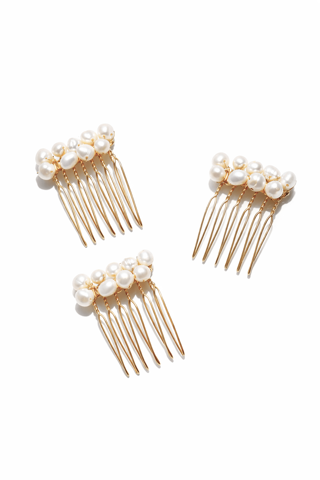 Three gold-filled freshwater pearl cluster hair combs. Affordable Canadian jewelry brands. Handmade Canadian jewelry. Canadian jewelry business. Organic pearl jewelry. Pearl jewelry sets. Bridal jewelry Canada. Pearl jewelry Canada. Pearl Bridal jewelry Canada. Canadian jewelry designer. Canadian jewelry designs. Pearl Hair Accessories. Bridal Hair accessories.
