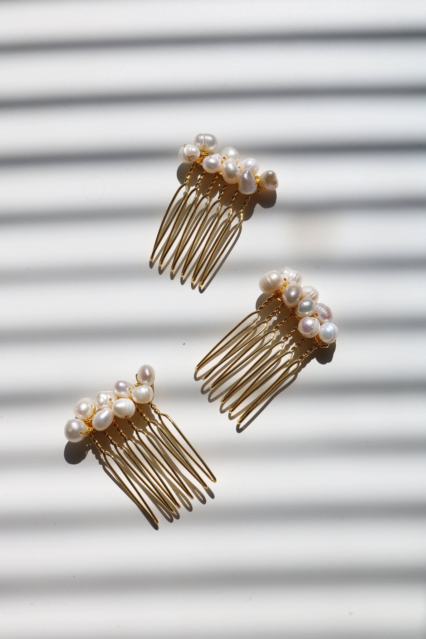 Gold multi-pearl hair combs for bridal. Affordable Canadian jewelry brands. Handmade Canadian jewelry. Canadian jewelry business. Organic pearl jewelry. Pearl jewelry sets. Bridal jewelry Canada. Pearl jewelry Canada. Pearl Bridal jewelry Canada. Canadian jewelry designer. Canadian jewelry designs. Pearl Hair Accessories. Bridal Hair accessories.