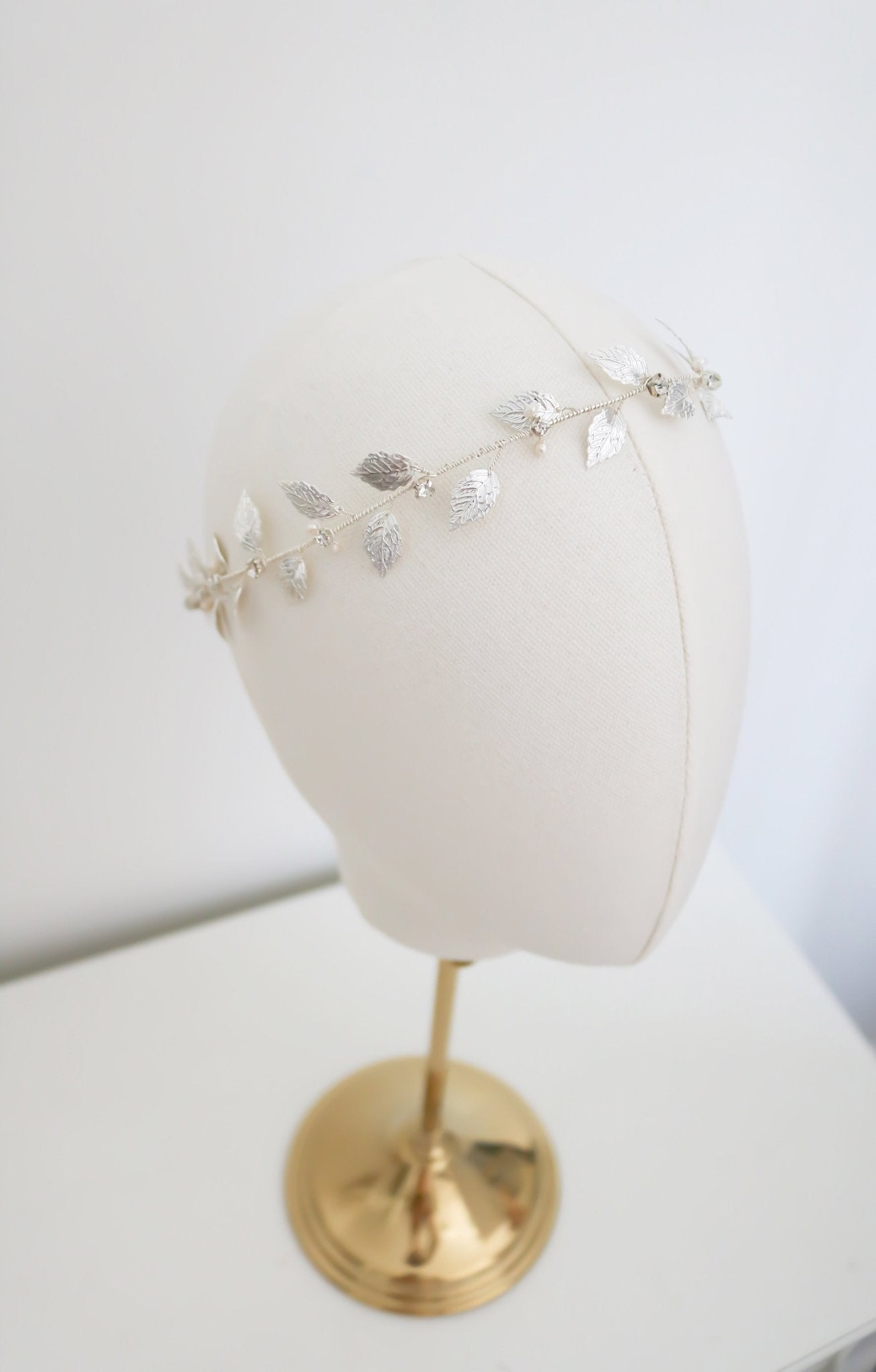 Aelia Leaf and Fresh Water Pearl Crystal Hair Circlet Displayed on Head Bust. Bridal Hair Accessories. Bridal Accessories. Canadian Bridal Accessories. Handmade Canadian Accessories. Canadian handmade Accessories. Canadian weddings. Wedding Canada. Organic pearl accessories. Pearl Bridal Hair Accessories. Pearl Bridal Accessories.