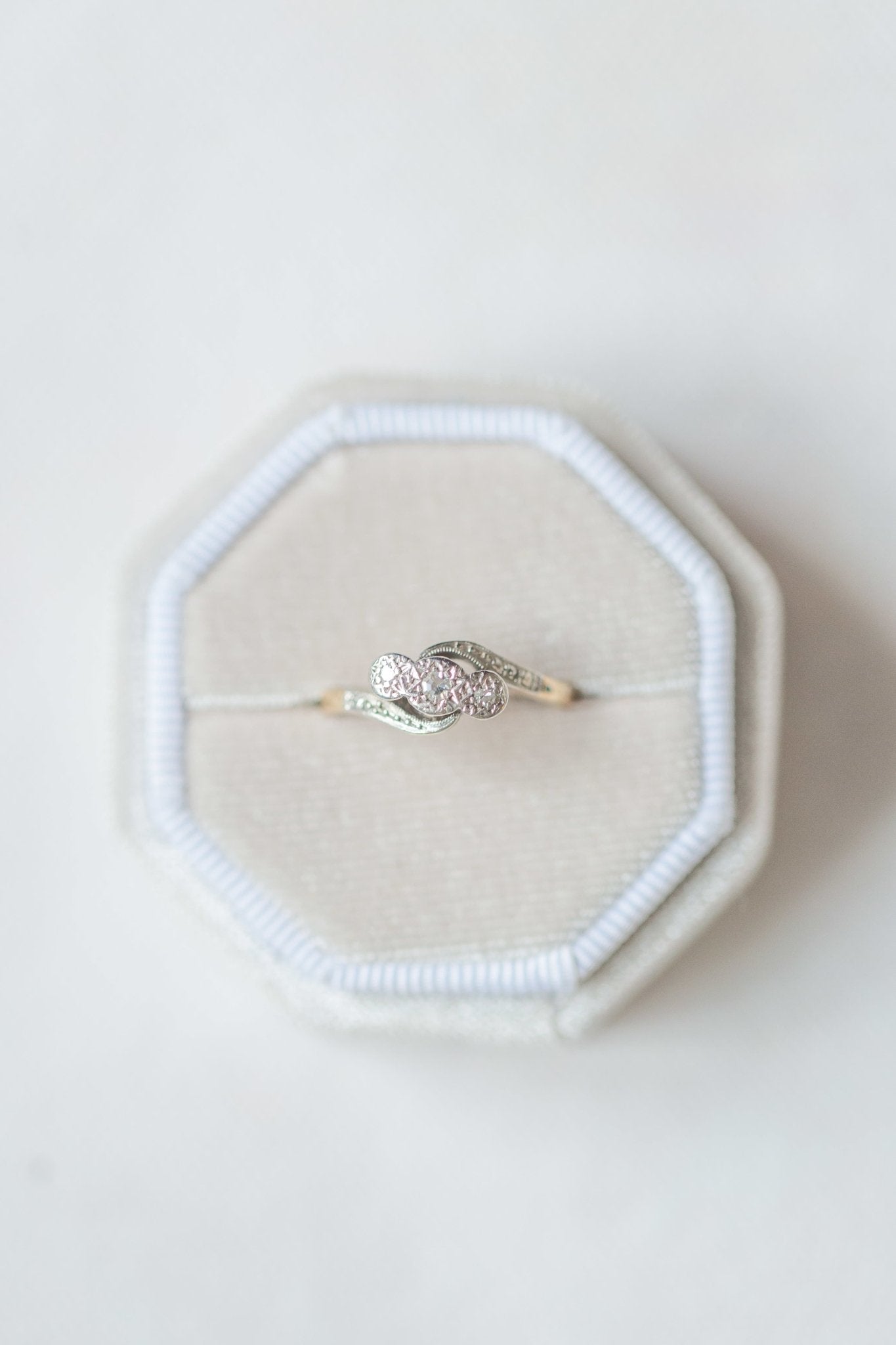 Amelie Trilogy Diamond Engagement Ring in 18k Gold and Platinum, Art Deco c.1930 sitting in cream colored ring box. Antique Engagement Rings Canada. Canadian vintage engagement rings. Vintage engagement rings Canada. Bridal jewelry Canada. Canadian weddings. Wedding Canada. Canadian jewelry brands. Affordable Canadian jewelry brands. Canadian bridal jewelry. Woman-owned Canadian jewelry brand. Canadian jewelry business.