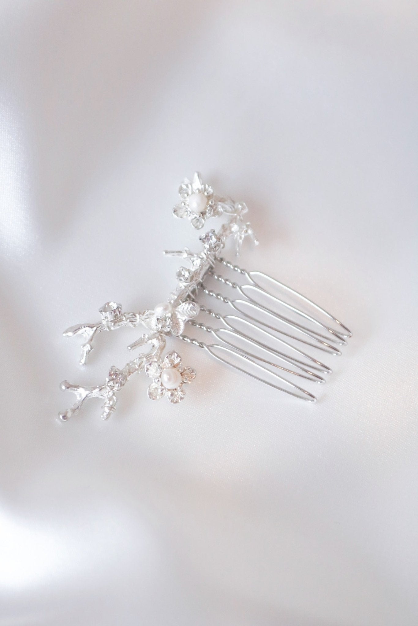 Close up of bridal hair accessories silver hair comb on white background. Bridal Hair Accessories. Bridal Accessories. Canadian Bridal Accessories. Handmade Canadian Accessories. Canadian handmade Accessories. Canadian weddings. Wedding Canada. Organic pearl accessories. Pearl Bridal Hair Accessories. Pearl Bridal Accessories.