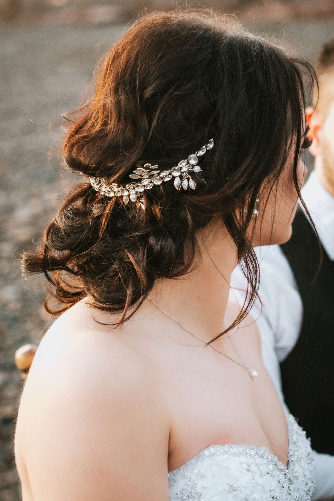 A bride and her groom on the beach chat while the bride's hair shimmers from her silver crystal hair crown. Bridal Hair Accessories. Bridal Accessories. Canadian Bridal Accessories. Handmade Canadian Accessories. Canadian handmade Accessories. Canadian weddings. Wedding Canada.