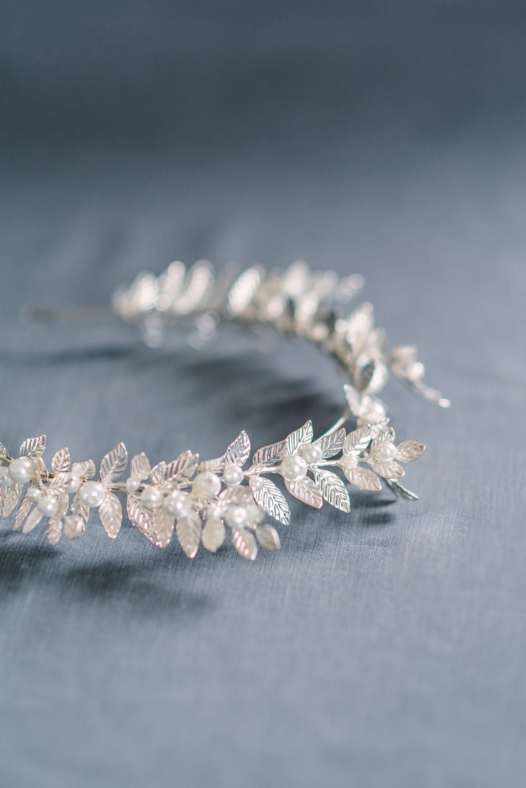 A silver bridal crown with shining leaves and freshwater pearls. Bridal Hair Accessories. Bridal Accessories. Canadian Bridal Accessories. Handmade Canadian Accessories. Canadian handmade Accessories. Canadian weddings. Wedding Canada. Canadian jewelry brands. Affordable Canadian jewelry brands. Organic pearl accessories. Pearl Bridal Hair Accessories. Pearl Bridal Accessories.