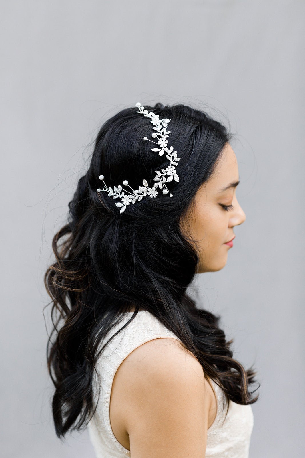 A silver crystal bridal hairpiece sits atop a beautiful bride's head. Bridal Hair Accessories. Bridal Accessories. Canadian Bridal Accessories. Handmade Canadian Accessories. Canadian handmade Accessories. Canadian weddings. Wedding Canada. Organic pearl accessories. Pearl Bridal Hair Accessories. Pearl Bridal Accessories.