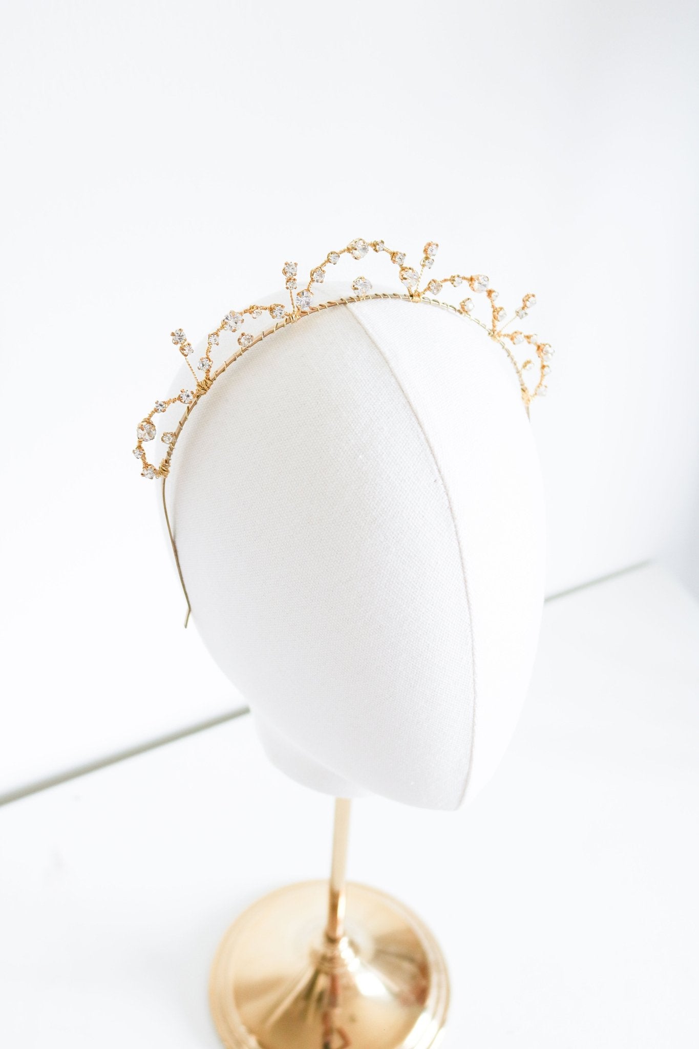 Avery Crystal Halo Headband displayed on top of a head bust. Bridal Hair Accessories. Bridal Accessories. Canadian Bridal Accessories. Handmade Canadian Accessories. Canadian handmade Accessories. Canadian weddings. Wedding Canada. Canadian designer. Canadian artist.