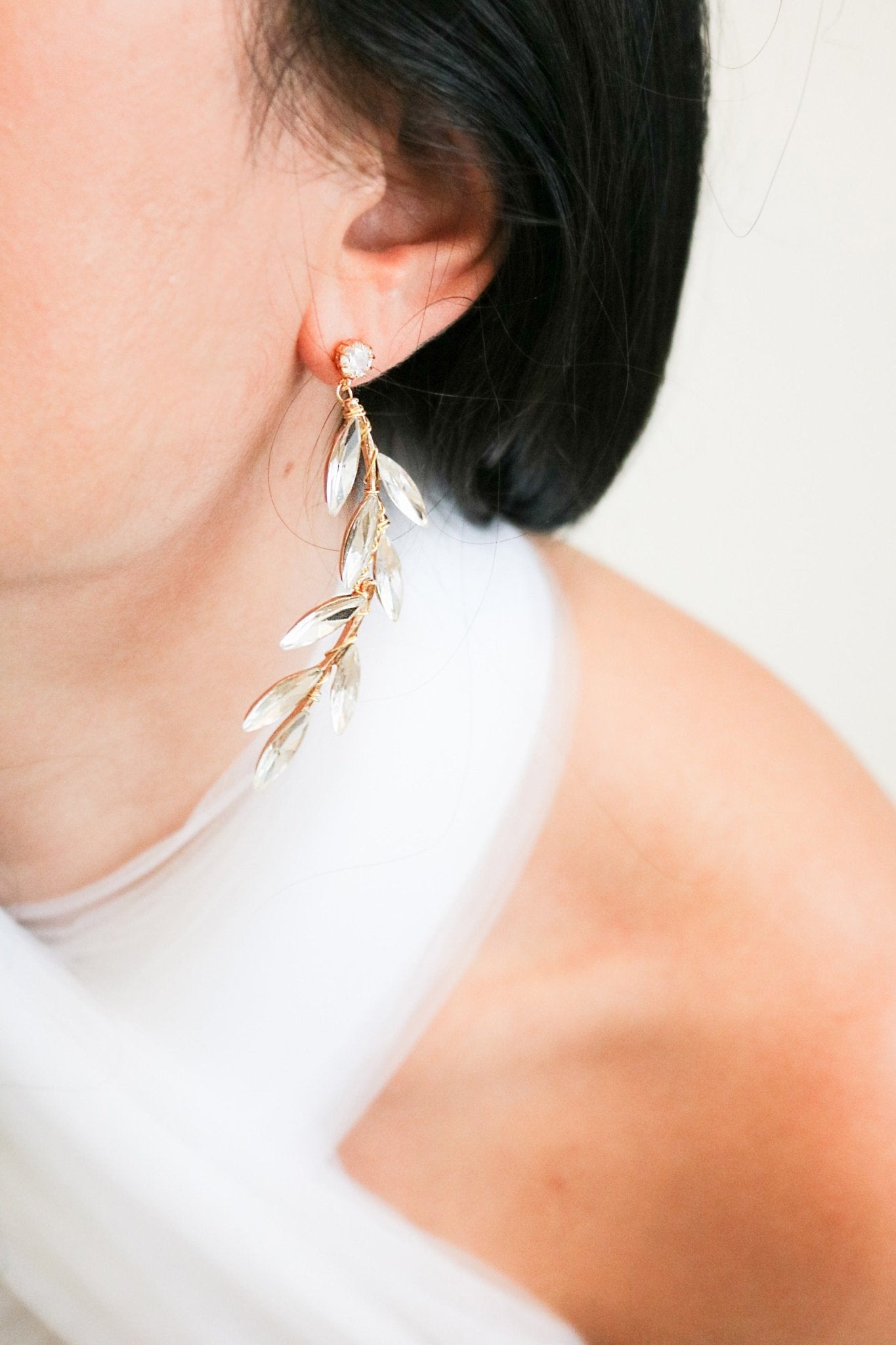 Drop down crystal leaf golden stud earrings for weddings. Gold-filled jewelry Canada. Gold-filled Canadian jewelry. Canadian jewelry brands. Affordable Canadian jewelry brands. Handmade Canadian jewelry. Canadian handmade jewelry. Canadian bridal jewelry. Statement Earrings. Statement Bridal Earrings. Canadian jewelry business.