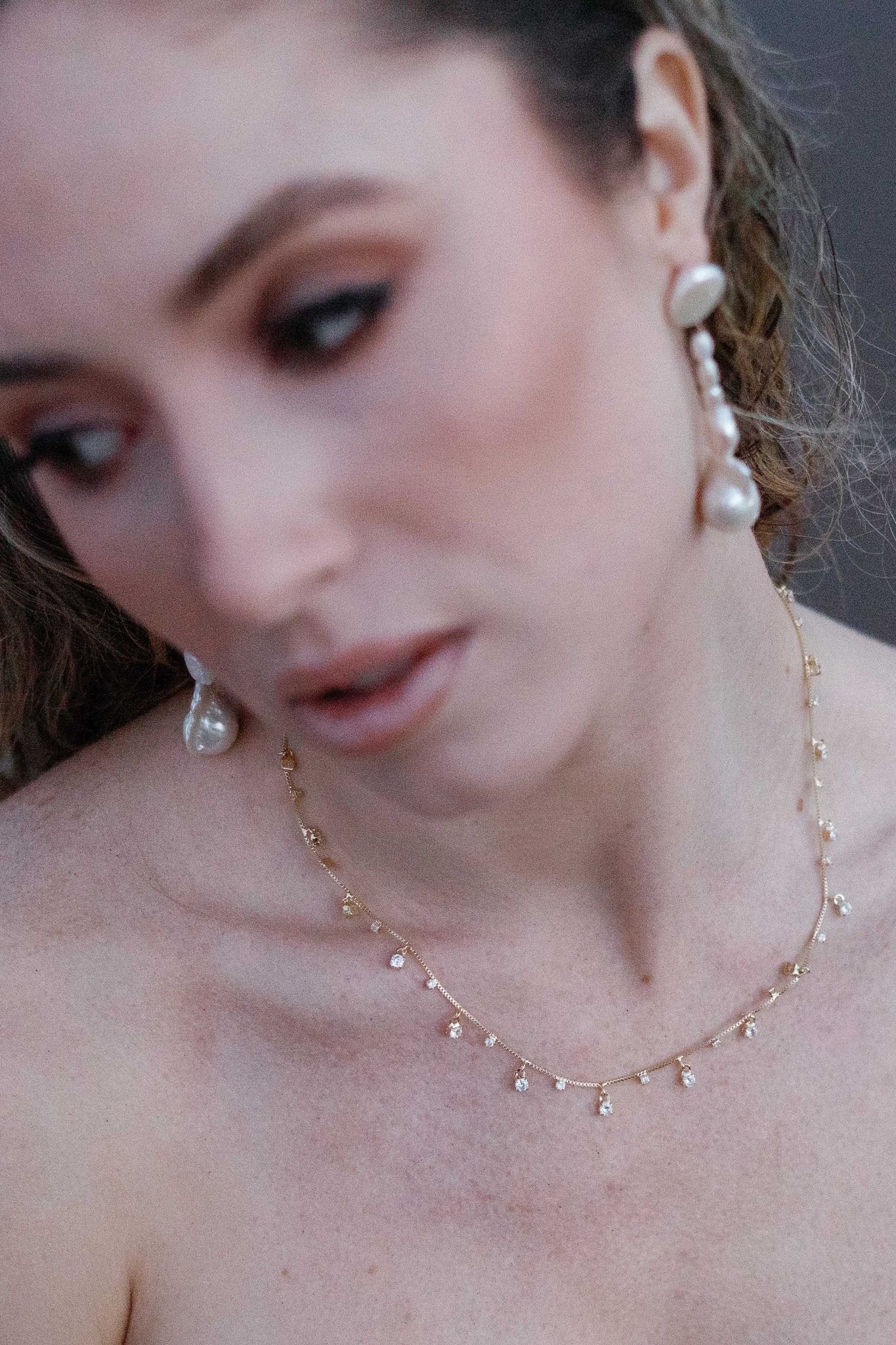 A gorgeous goddess draped with a stardust necklace paired with long dangle freshwater pearl earrings. Canadian jewelry brands. Pearl Bridal jewelry Canada. Canadian jewelry brands. Canadian jewelry business. Organic pearl jewelry. Pearl jewelry sets. Statement Earrings. Statement Bridal Earrings.