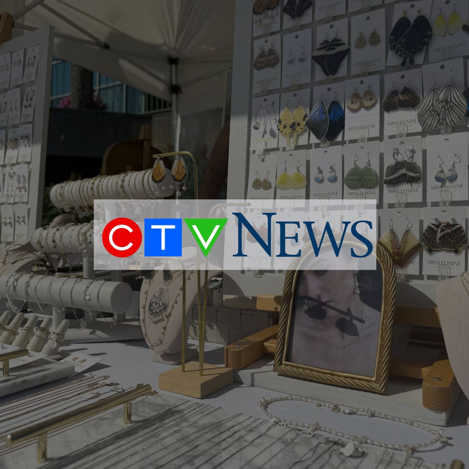 Display of handmade jewelry at a market with CTV News logo overlay