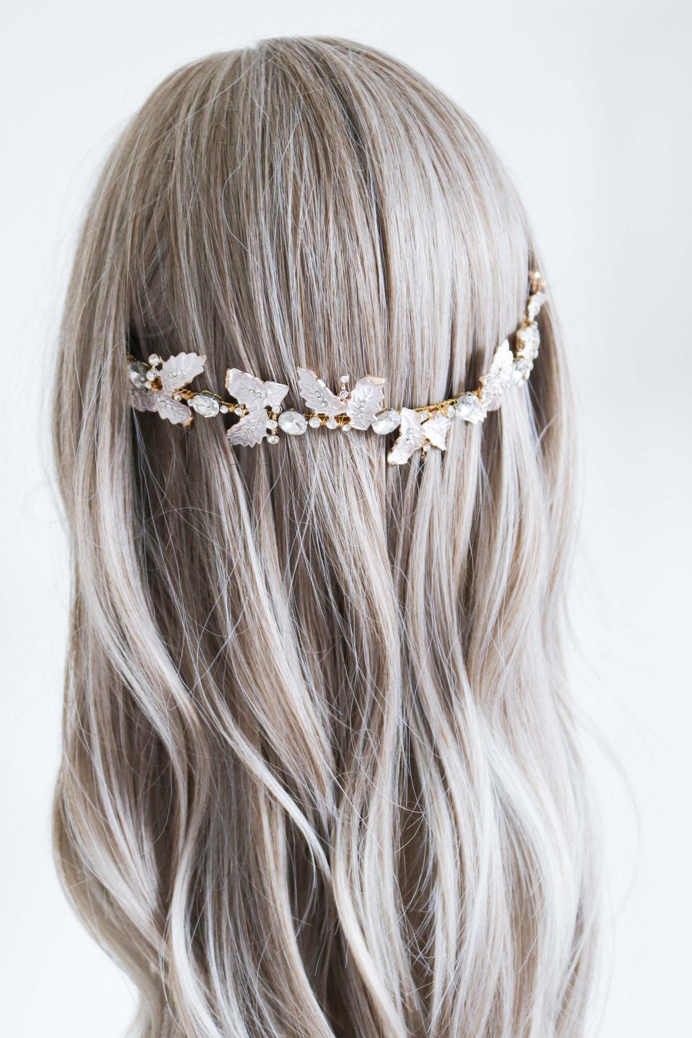Detailed gold bridal headband with leaves and crystals set back in long wavy hair. Bridal Hair Accessories. Bridal Accessories. Canadian Bridal Accessories. Handmade Canadian Accessories. Canadian handmade Accessories. Canadian weddings. Wedding Canada. Canadian designer. Canadian artist.