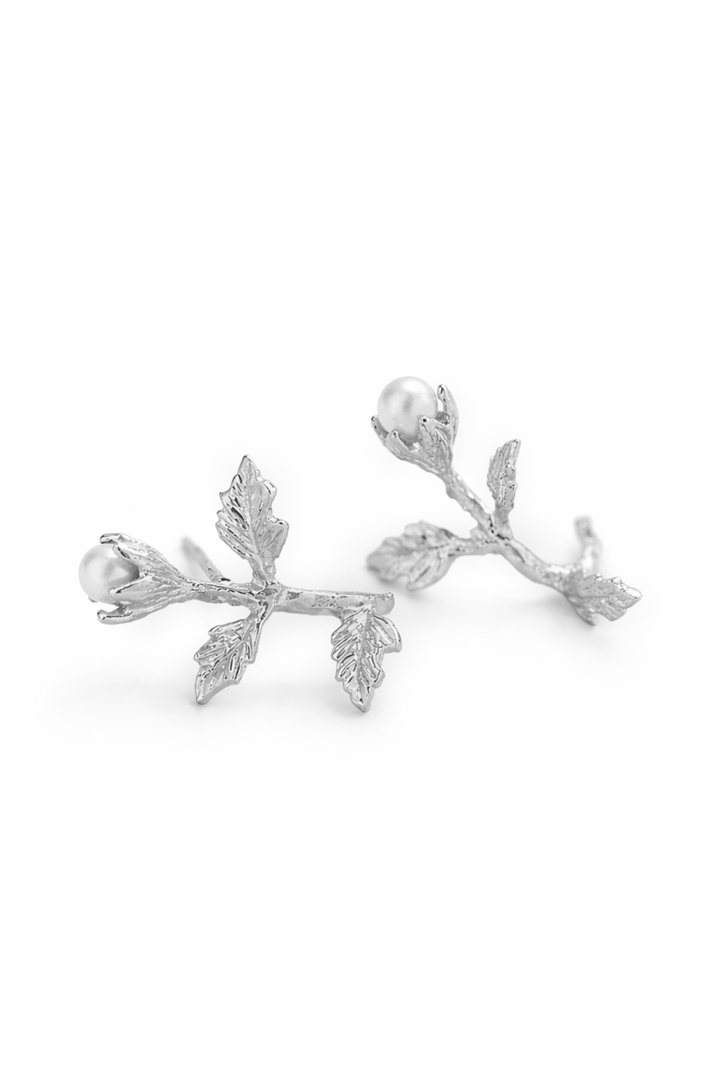 A pair of sterling silver freshwater pearl & flower stud earrings. Pearl Bridal jewelry, sterling silver jewelry & Canadian handmade jewelry by Woman-owned Canadian jewelry brand