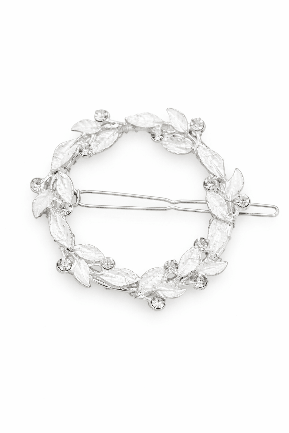 Circular silver bridal hairclip with leaf design and crystals on a white background. Bridal hair accessories & everyday hair accessories for brides and weddings by small bridal business