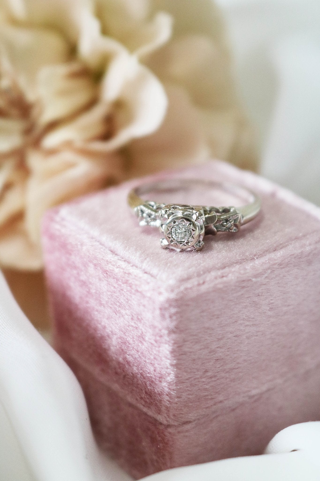 A 14k White Gold and Diamond Vintage Engagement Ring on a pink ring box. Antique Engagement Ring. Canadian vintage engagement rings. Bridal jewelry Canada. Wedding Canada. Small Canadian jewelry brands. Canadian bridal jewelry. Woman-owned Canadian jewelry brand. Canadian jewelry business.