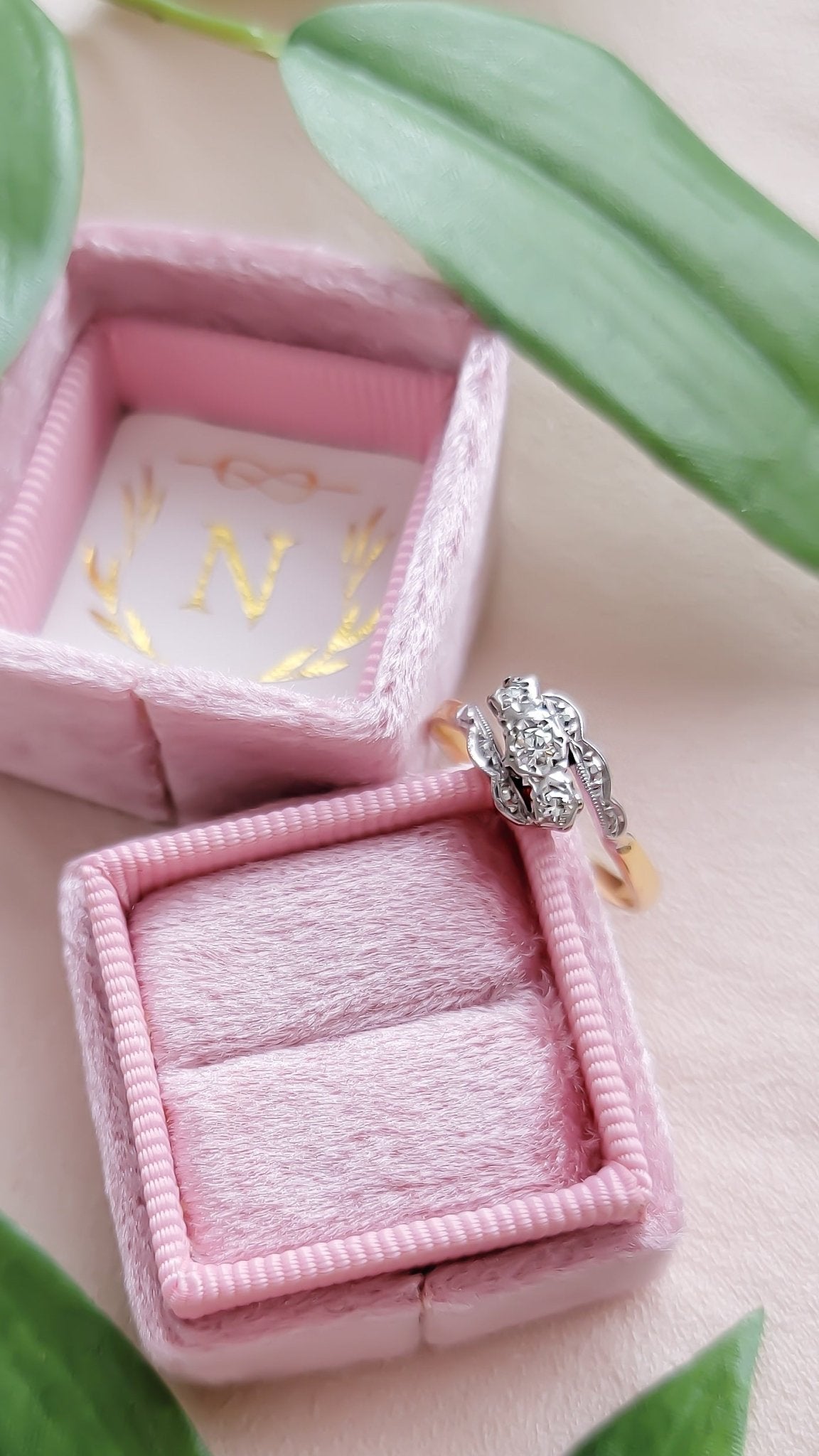Vintage engagement ring in 18ct gold and platinum with diamonds leans against a ring box. Antique Engagement Rings Canada. Canadian vintage engagement rings. Vintage engagement rings Canada. Bridal jewelry Canada. Canadian weddings. Wedding Canada. Canadian jewelry brands. Affordable Canadian jewelry brands. Canadian jewelry business.