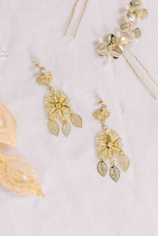 Gold-Filled bridal earrings with Swarovski crystals and sterling silver posts against a white background with hairpieces. Bridal jewelry Canada. Gold-filled jewelry Canada. Gold-filled Canadian jewelry. Canadian jewelry brands. Canadian jewelry designs. Statement Earrings. Statement Bridal Earrings. Canadian bridal jewelry. Canadian jewelry brands.