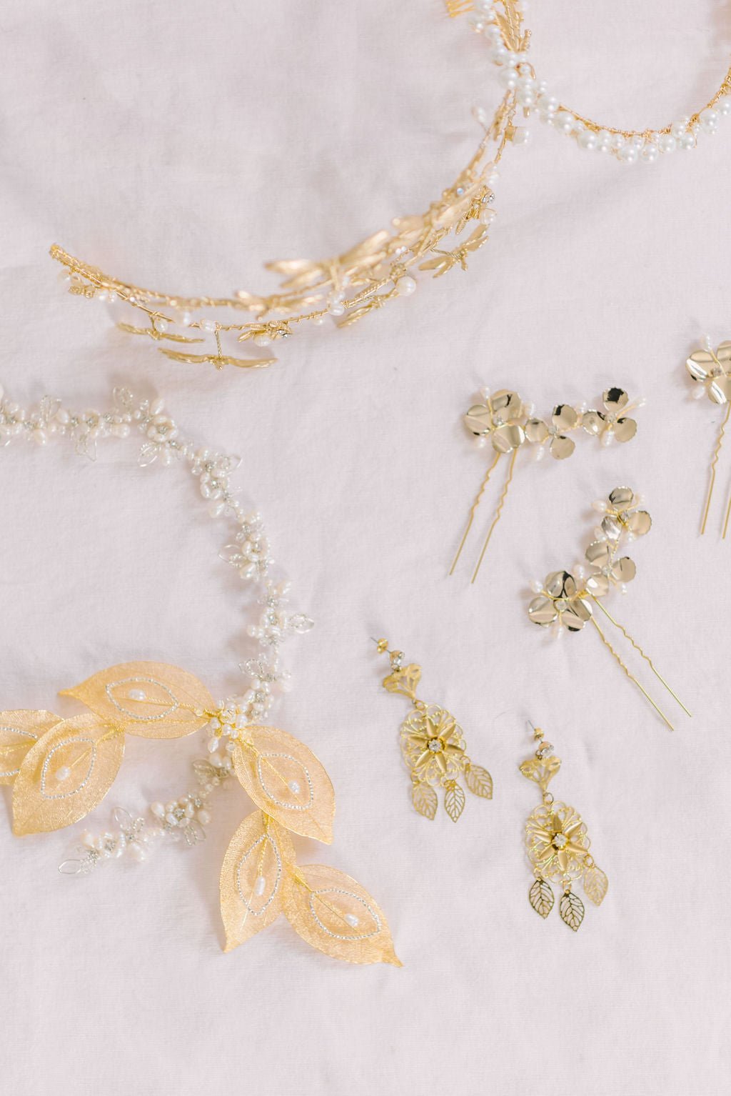 Gold-Filled bridal earrings with Swarovski crystals and sterling silver posts against a white background with hairpieces. Bridal jewelry Canada. Gold-filled jewelry Canada. Gold-filled Canadian jewelry. Canadian jewelry brands. Canadian jewelry designs. Statement Earrings. Statement Bridal Earrings. Canadian bridal jewelry. Canadian jewelry brands.