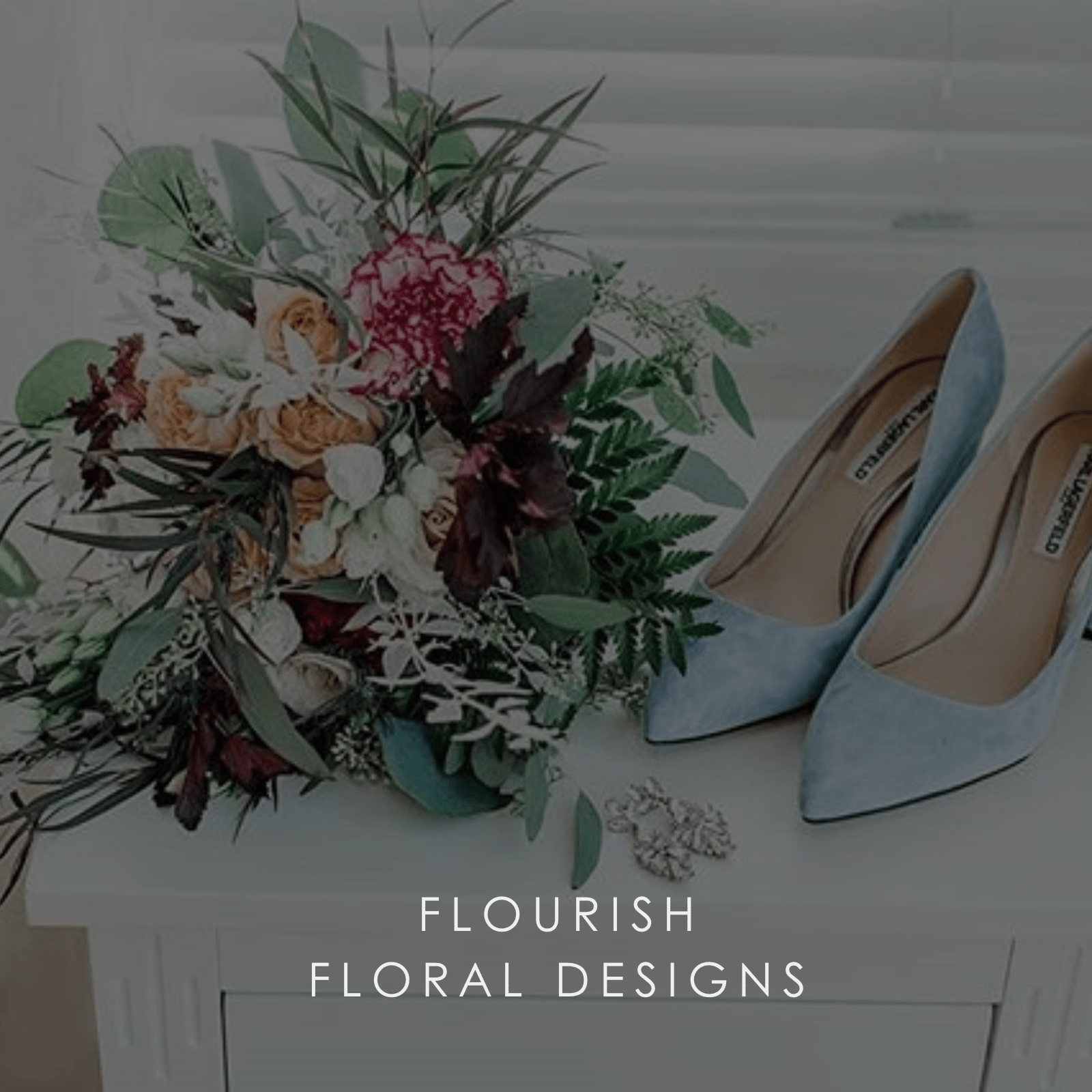 A bridal flower bouquet and pale blue shoes.