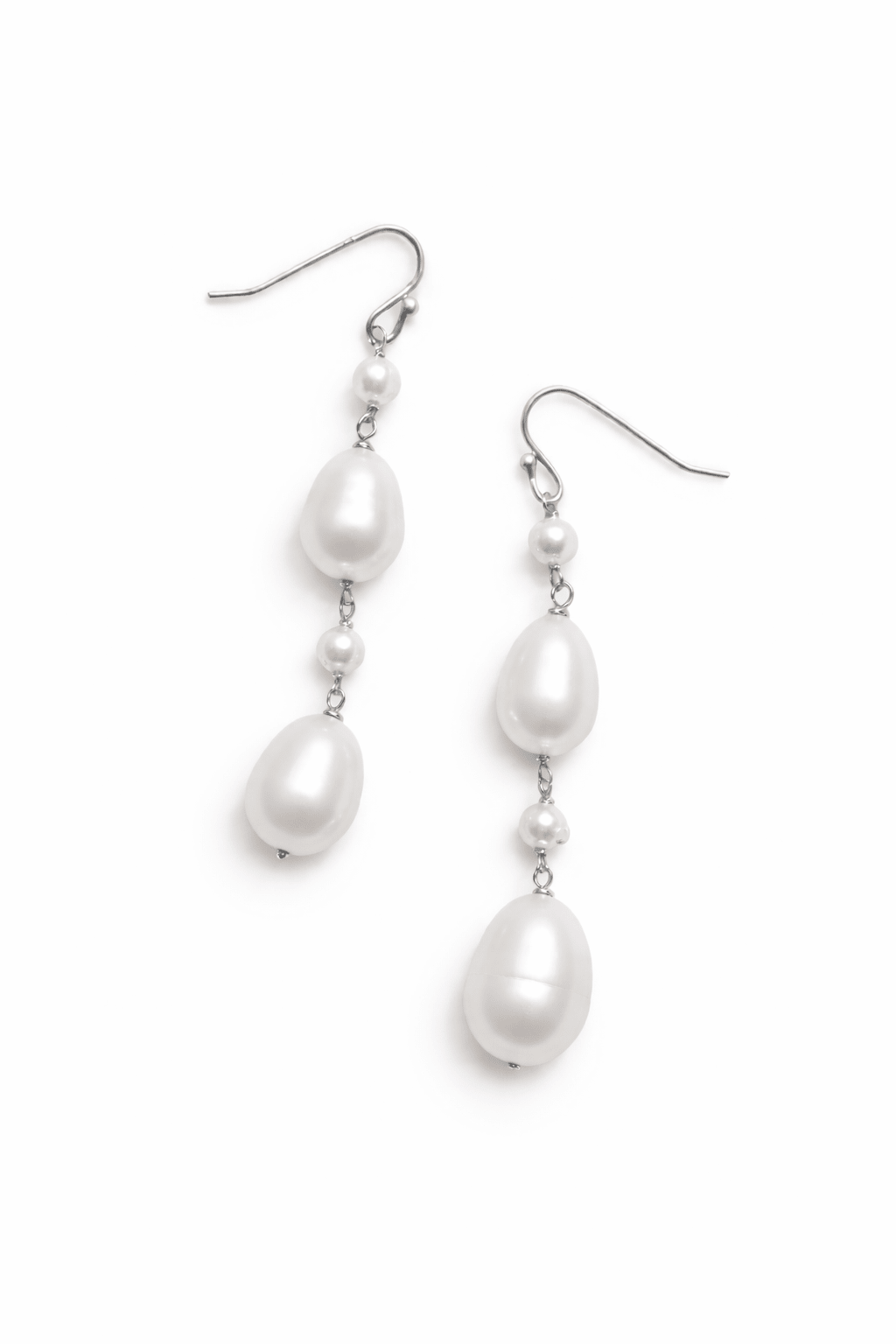 Sterling silver freshwater pearl drop earrings on a white background. Pearl bridal jewelry & affordable bridal jewelry handmade in Canada by small jewelry business
