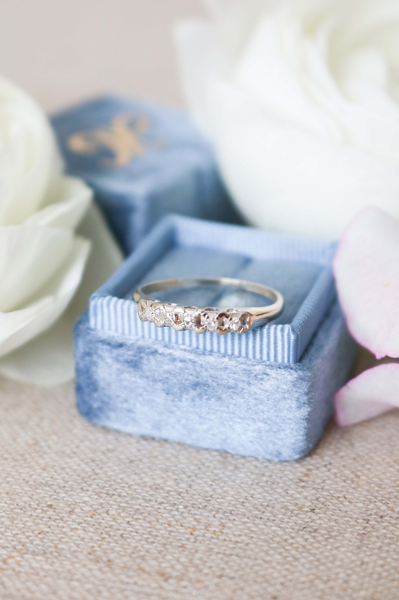 Harmony Vintage Engagement RIng/Wedding Band in 14ct Gold with multiple Diamonds sitting on a ring box. Canadian vintage engagement rings. Vintage engagement rings Canada. Bridal jewelry Canada. Canadian jewelry brands. Affordable Canadian jewelry brands. Canadian bridal jewelry. Woman-owned Canadian jewelry brand. Antique Engagement Rings Canada. Wedding Canada.