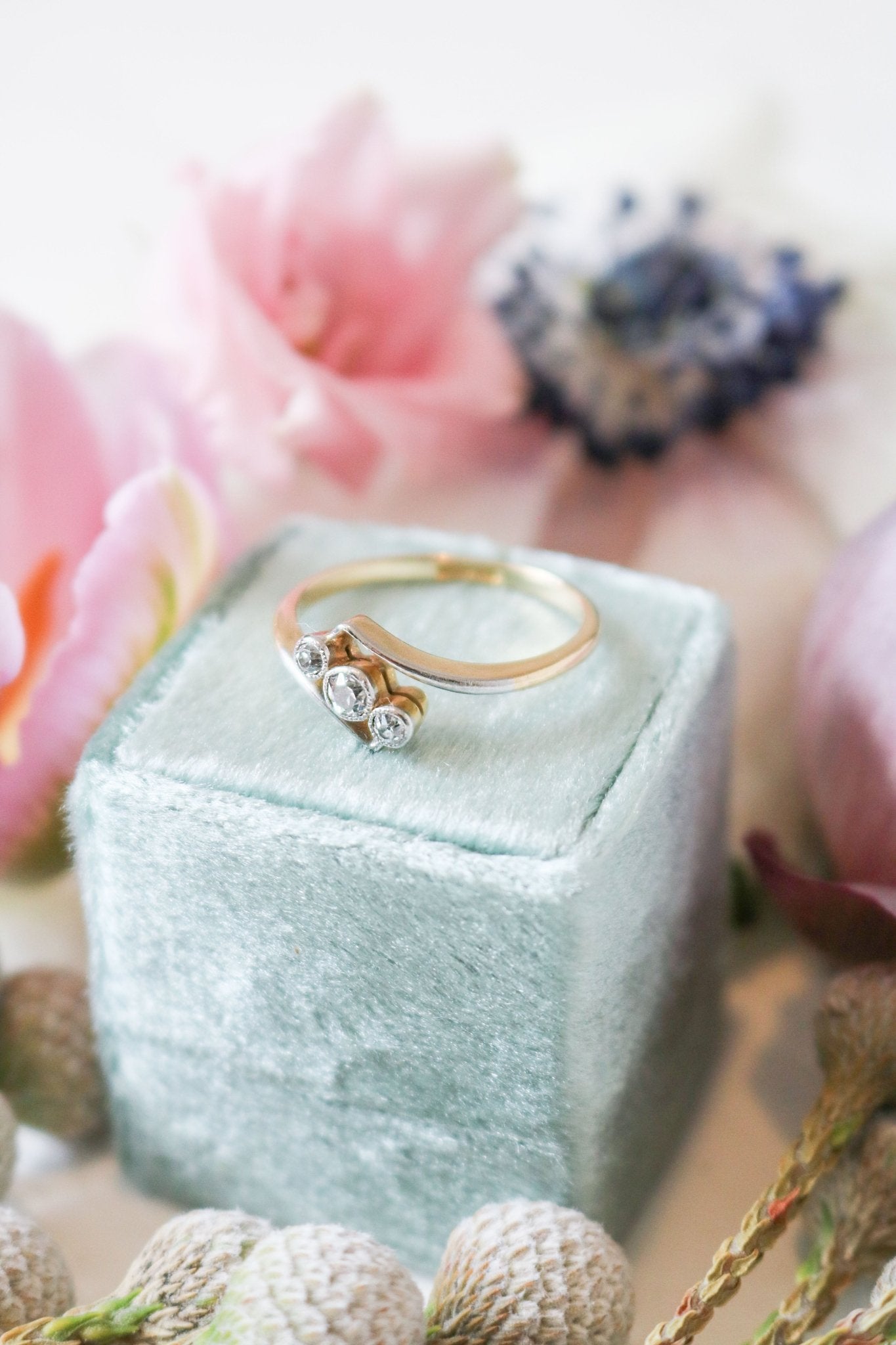 An 18ct Gold and Platinum Harper Art Deco Style Diamond Trilogy Vintage Engagement Ring. Antique Engagement Rings Canada. Canadian vintage engagement rings. Vintage engagement rings Canada. Bridal jewelry Canada. Canadian weddings. Wedding Canada. Canadian bridal jewelry. Woman-owned Canadian jewelry brand. Canadian jewelry business.