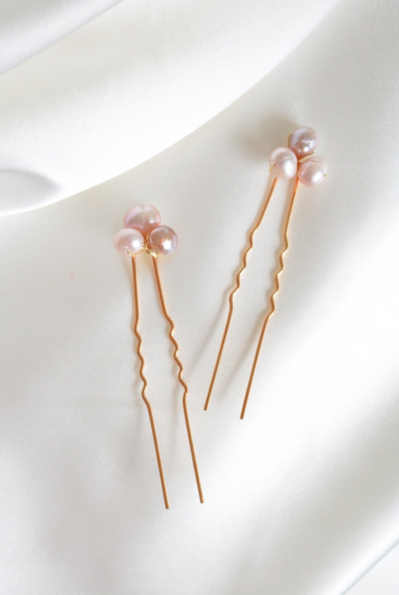 A set of two Hayley Blush Fresh Water Pearl Bridal Hairpins on a white background. Organic pearl accessories. Pearl Bridal Hair Accessories. Pearl Bridal Accessories. Bridal Hair Accessories. Bridal Accessories. Canadian Bridal Accessories. Handmade Canadian Accessories. Canadian handmade Accessories. Canadian weddings. Wedding Canada.