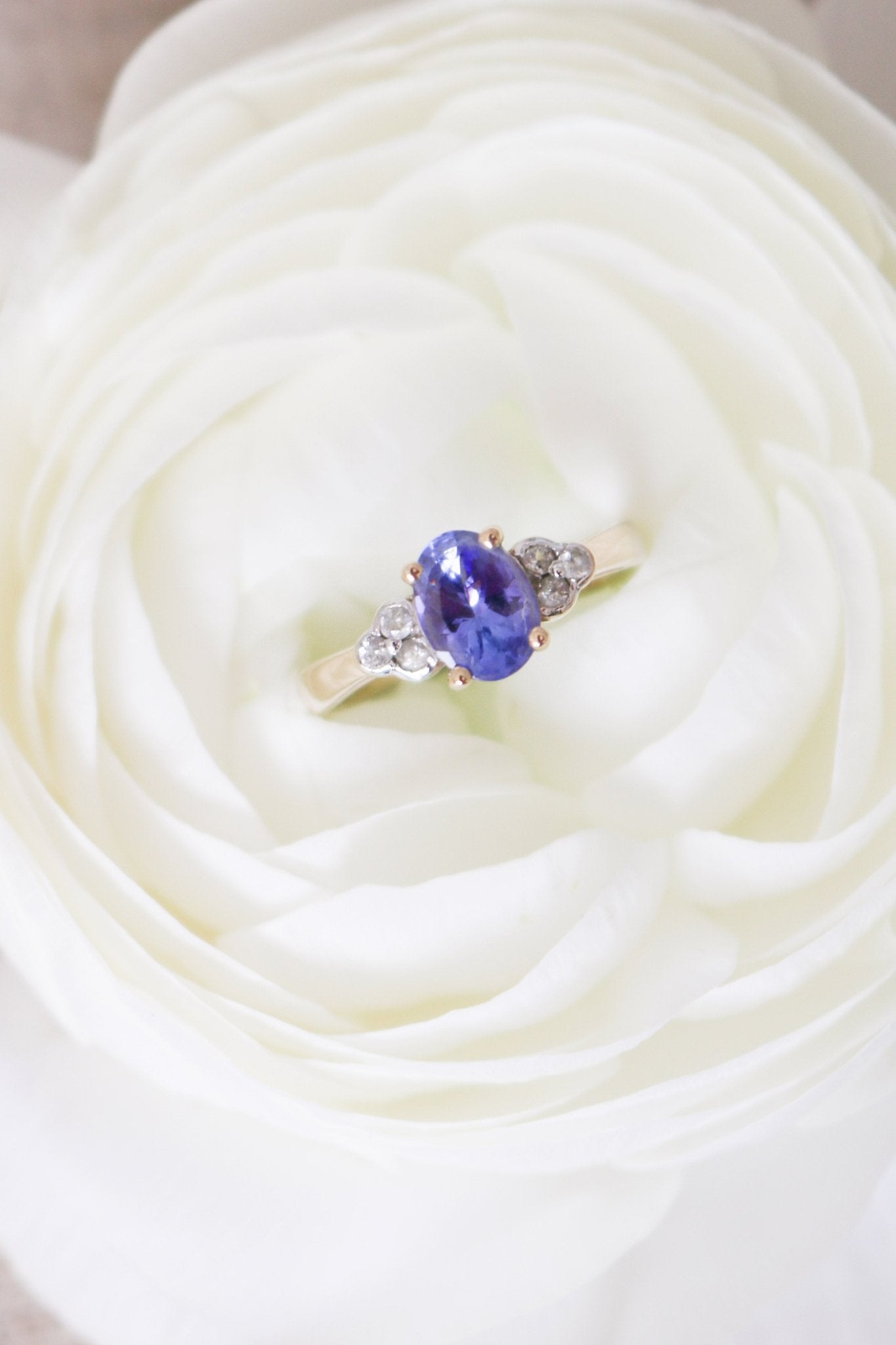 The Jolie Violet Tanzanite and White Topaz 9ct Vintage Engagement Ring nestled in a white rose. Antique Engagement Rings Canada. Canadian vintage engagement rings. Vintage engagement rings Canada. Bridal jewelry Canada. Wedding Canada. Canadian bridal jewelry
Woman-owned Canadian jewelry brand. Small Canadian jewelry brands.
