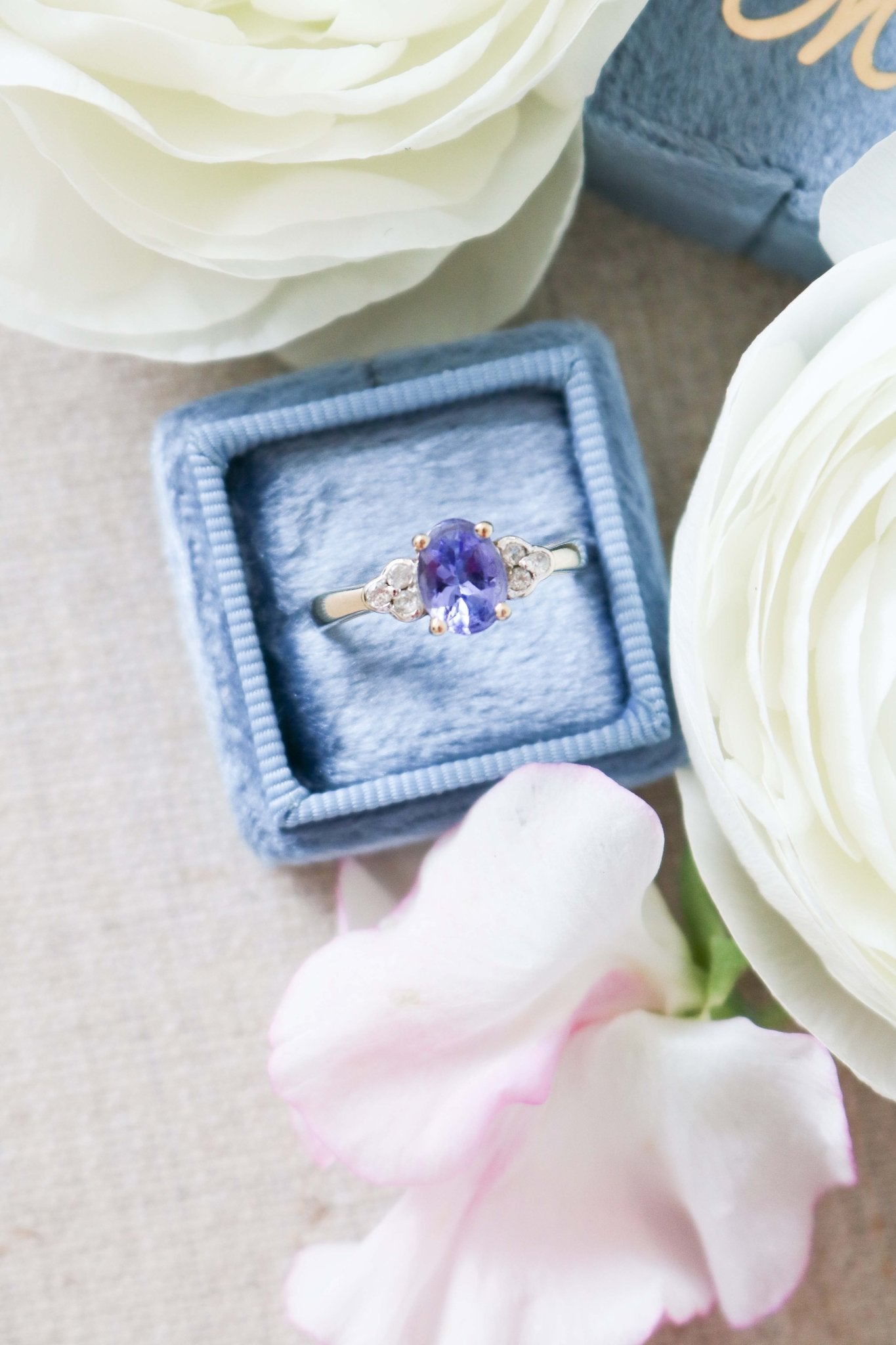 A close up top view of the Jolie Violet Tanzanite and White Topaz Vintage Engagement Ring in 9ct Gold. Antique Engagement Rings Canada. Canadian vintage engagement rings. Vintage engagement rings Canada. Bridal jewelry Canada. Wedding Canada. Canadian bridal jewelry
Woman-owned Canadian jewelry brand. Small Canadian jewelry brands.