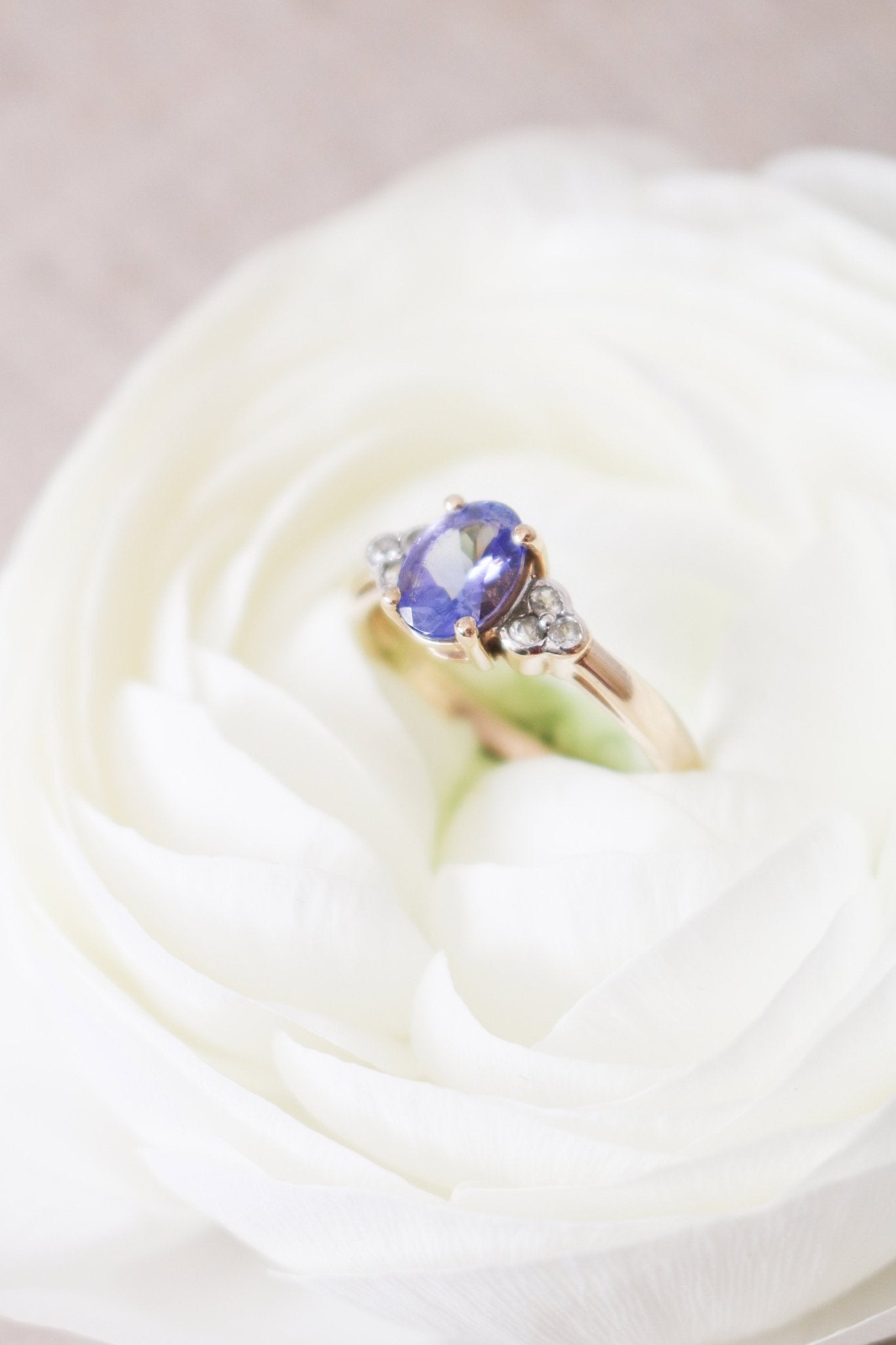 The Jolie Violet Tanzanite and White Topaz 9ct Vintage Engagement Ring nestled in a white rose. Antique Engagement Rings Canada. Canadian vintage engagement rings. Vintage engagement rings Canada. Bridal jewelry Canada. Wedding Canada. Canadian bridal jewelry
Woman-owned Canadian jewelry brand. Small Canadian jewelry brands.