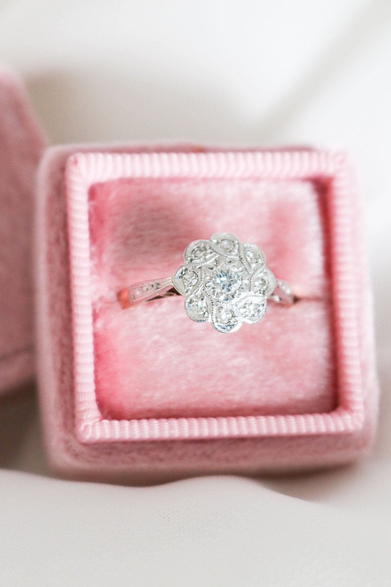 A Lilibet Diamond Vintage Engagement Ring in 18k Yellow Gold and Platinum, Art Deco 1930s close up in a pink ring box. Canadian vintage engagement rings. Bridal jewelry Canada. Vintage engagement rings Canada. Canadian weddings. Wedding Canada. Woman-owned Canadian jewelry brand. Canadian jewelry business. Small Canadian jewelry brands.