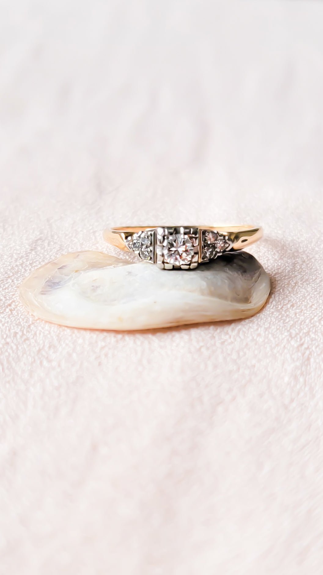 Front view of the Lisbet Vintage Diamond Engagement Ring on top of a seashell. Antique Engagement Rings Canada. Canadian vintage engagement rings. Vintage engagement rings Canada. Bridal jewelry Canada. Canadian bridal jewelry. Woman-owned Canadian jewelry brand. Canadian jewelry business. Canadian weddings.