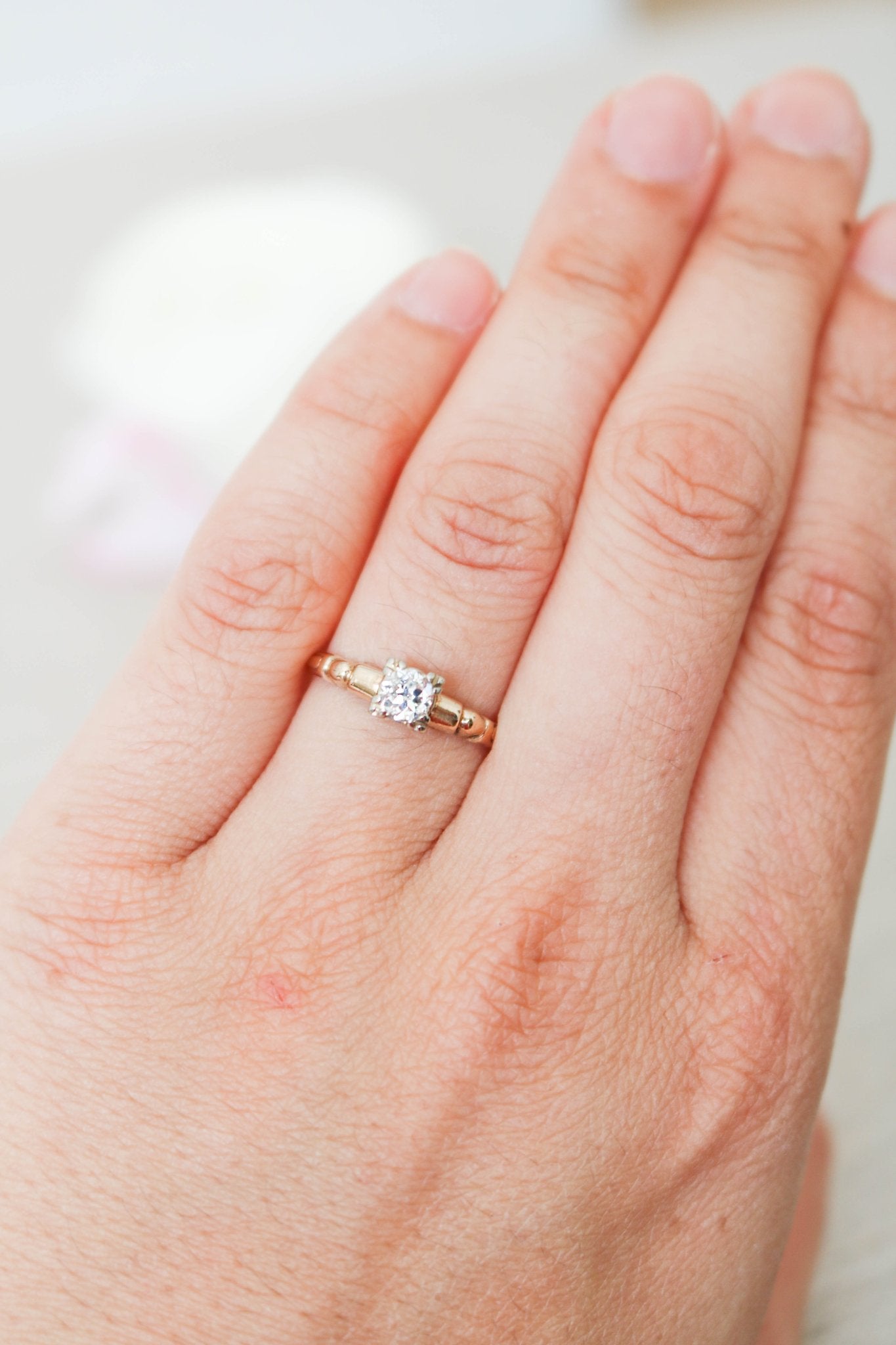 A Gold and Diamond Engagement Ring on ring finger. Antique Engagement Rings Canada. Canadian vintage engagement rings. Vintage engagement rings Canada. Bridal jewelry Canada. Canadian weddings. Wedding Canada. Canadian bridal jewelry. Woman-owned Canadian jewelry brand. Canadian jewelry business.