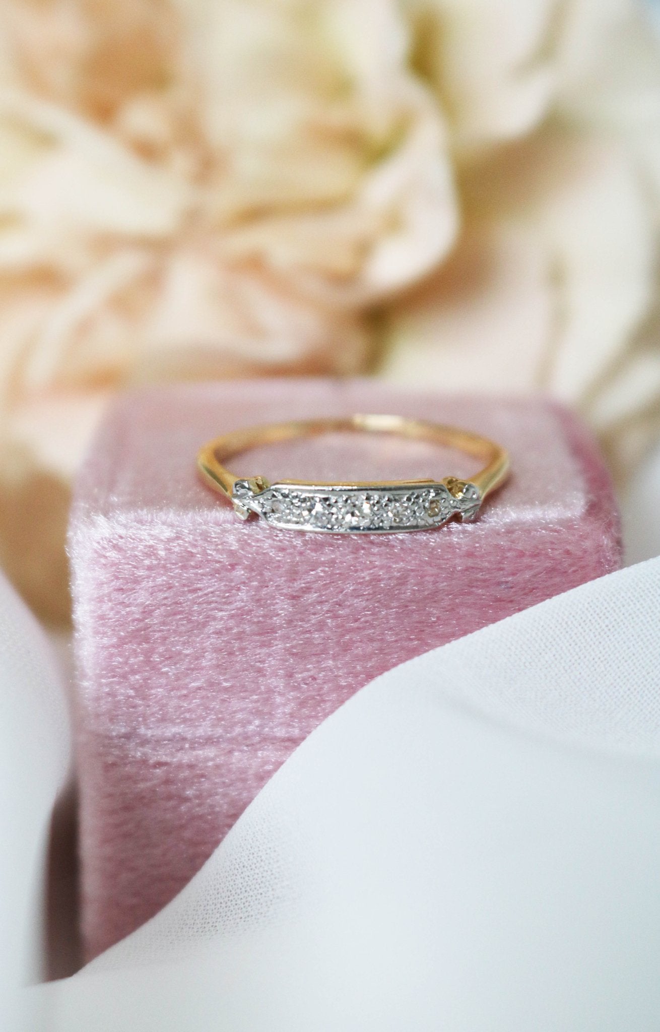 Front view of the Livie Diamond Vintage Engagement Ring/Wedding Band in 18k Yellow and White Gold sitting atop a ring box. Canadian vintage engagement rings. Bridal jewelry Canada. Canadian weddings. Wedding Canada. Small Canadian jewelry brands. Canadian jewelry brands. Affordable Canadian jewelry brands.