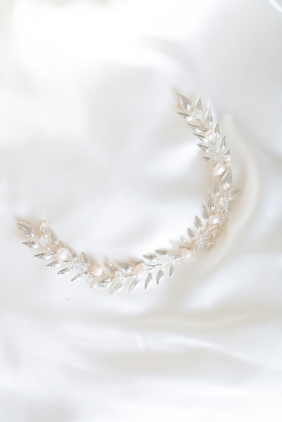 A silver version of the Loriana Laurel Bridal Hairvine with Fresh Water Pearls. Organic pearl accessories. Pearl Bridal Hair Accessories. Pearl Bridal Accessories. Bridal Hair Accessories. Bridal Accessories. Canadian Bridal Accessories. Handmade Canadian Accessories. Canadian handmade Accessories. Canadian weddings. Wedding Canada.
