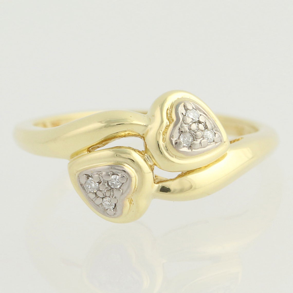 An extreme close up of the Love Bird double diamond heart 10k gold engagement ring. Antique Engagement Rings Canada. Canadian vintage engagement rings. Vintage engagement rings Canada. Bridal jewelry Canada. Canadian weddings. Wedding Canada. Canadian jewelry brands. Affordable Canadian jewelry brands. Canadian bridal jewelry. Woman-owned Canadian jewelry brand.