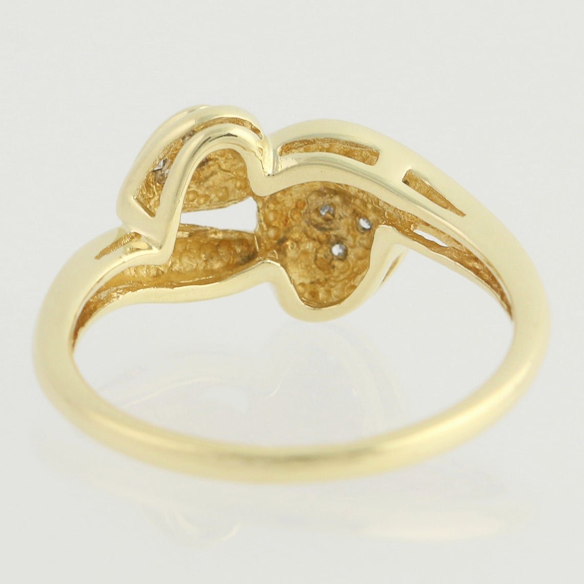 An extreme close up of the back of the Love Bird double diamond heart 10k gold engagement ring. Antique Engagement Rings Canada. Canadian vintage engagement rings. Vintage engagement rings Canada. Bridal jewelry Canada. Canadian weddings. Wedding Canada. Canadian jewelry brands. Affordable Canadian jewelry brands. Canadian bridal jewelry. Woman-owned Canadian jewelry brand.