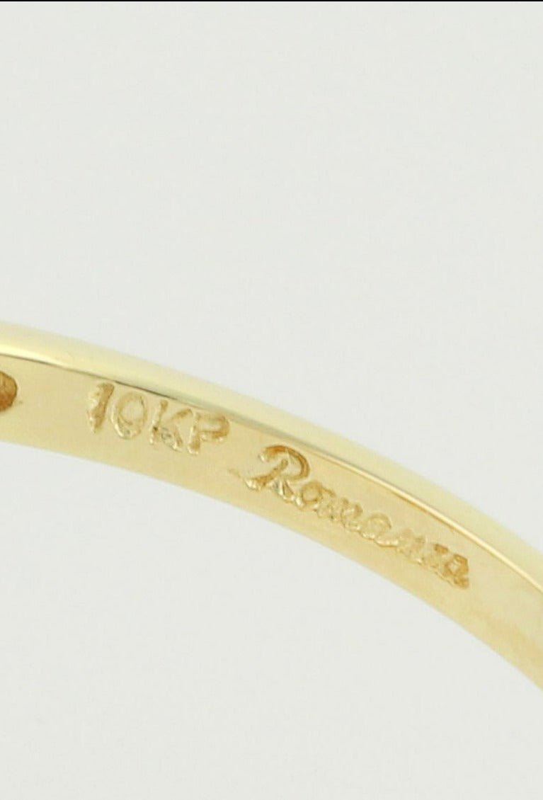 An extreme close up of the inside of the Love Bird Engagement Ring showcasing 10k Gold stamp. Antique Engagement Rings Canada. Canadian vintage engagement rings. Vintage engagement rings Canada. Bridal jewelry Canada. Canadian weddings. Wedding Canada. Canadian jewelry brands. Affordable Canadian jewelry brands. Canadian bridal jewelry. Woman-owned Canadian jewelry brand.