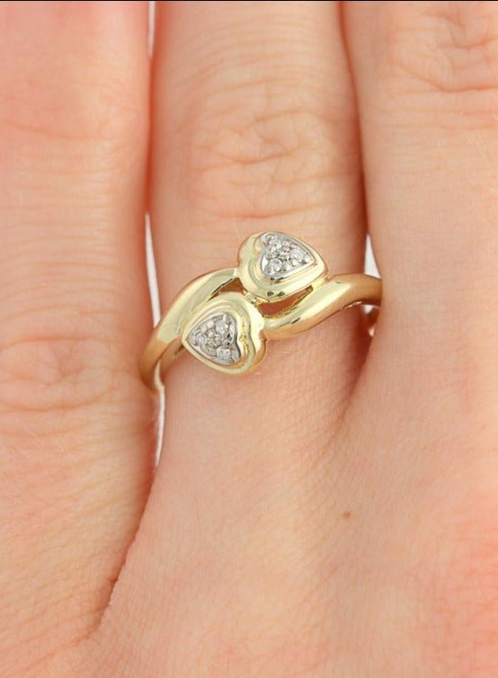 A close up of the Love Bird double diamond heart 10k gold engagement ring on a ring finger. Antique Engagement Rings Canada. Canadian vintage engagement rings. Vintage engagement rings Canada. Bridal jewelry Canada. Canadian weddings. Wedding Canada. Canadian jewelry brands. Affordable Canadian jewelry brands. Canadian bridal jewelry. Woman-owned Canadian jewelry brand.