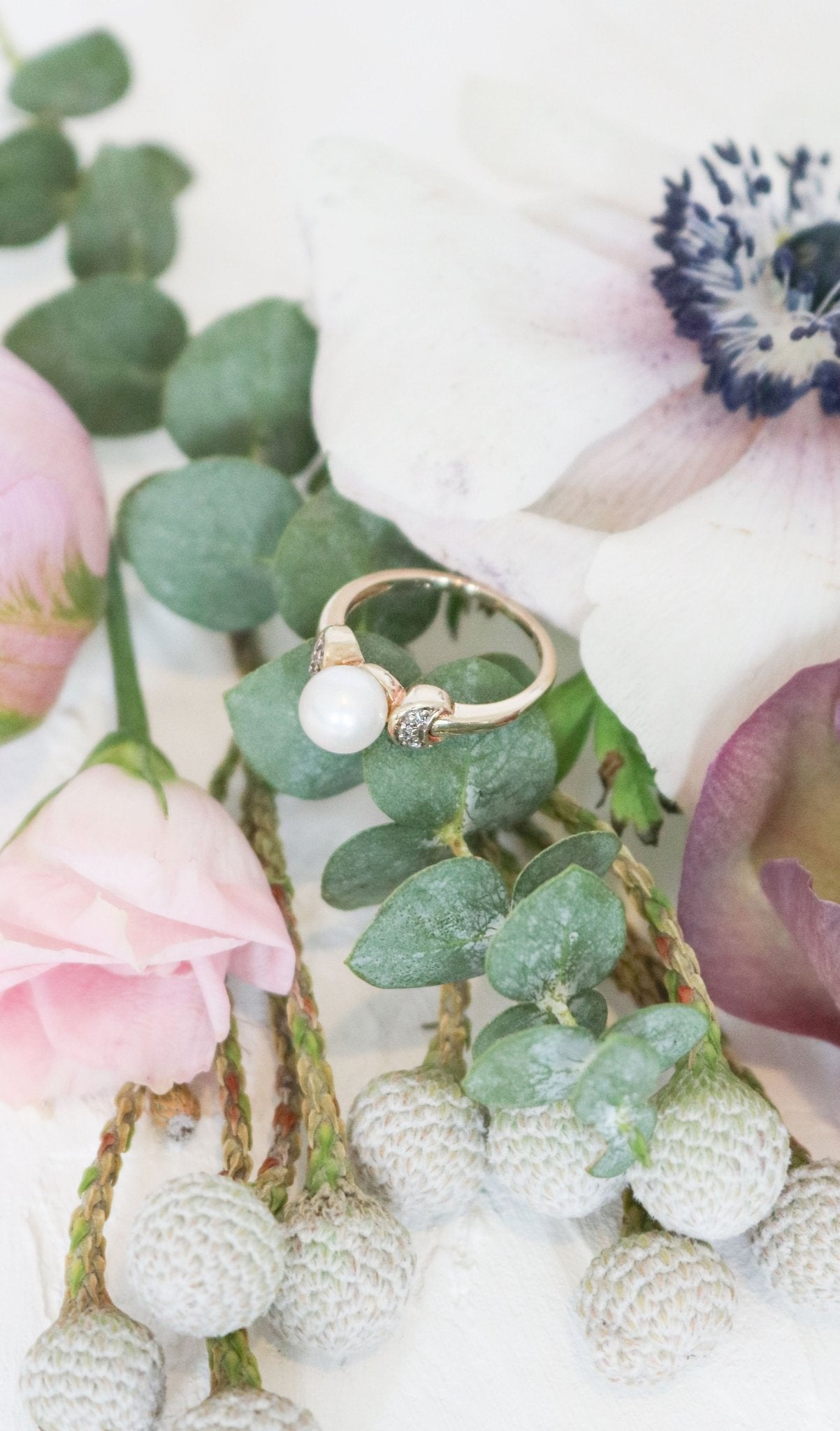 9ct Gold vintage engagement ring with Pearl and diamonds on top of eucalyptus leaves. Canadian jewelry designs. Antique Engagement Rings Canada. Canadian vintage engagement rings. Vintage engagement rings Canada. Bridal jewelry Canada. Pearl jewelry Canada. Pearl Bridal jewelry Canada. Canadian jewelry brands. Organic pearl jewelry.