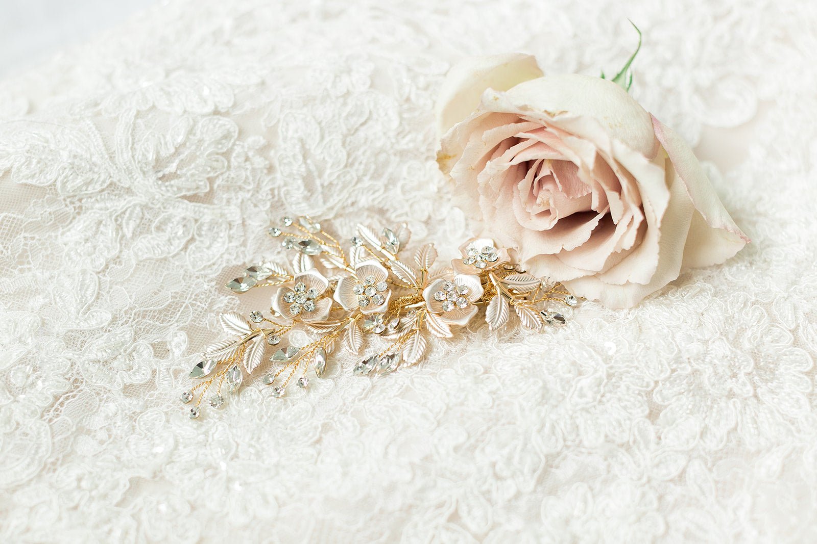 Gold floral bridal hair accessory with crystals and a dusty pink rose on a white lace background. Handmade wedding hair accessories & bridal accessories Canada