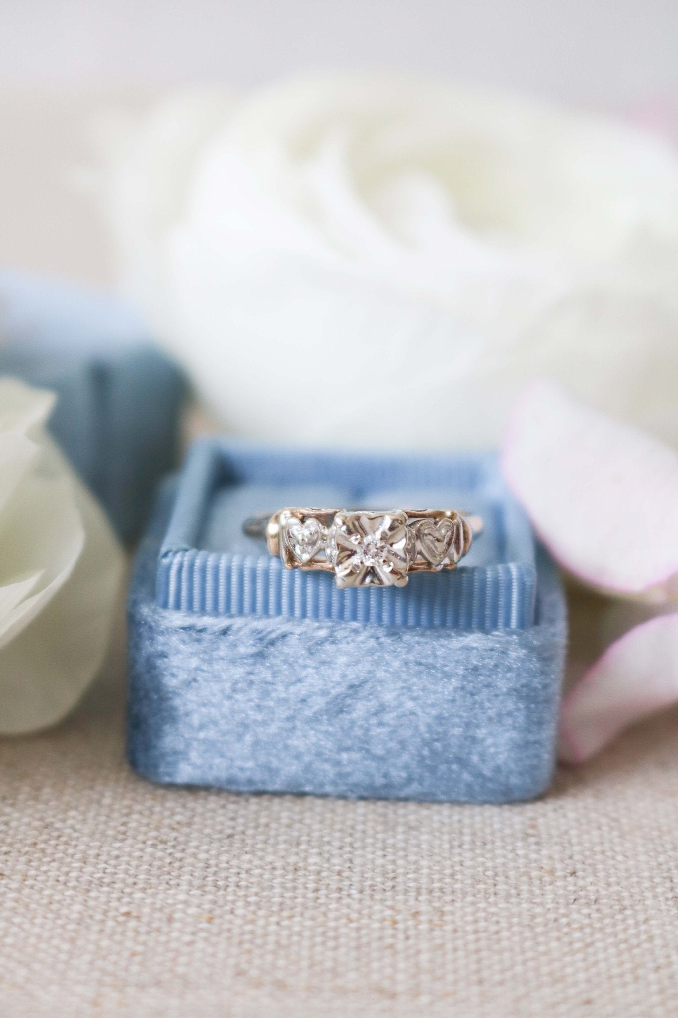 Front view of Yellow and White Gold Vintage Engagement Ring with Diamond Hearts on top of ring box. Antique Engagement Rings Canada. Canadian vintage engagement rings. Vintage engagement rings Canada. Bridal jewelry Canada. Canadian weddings. Wedding Canada. Canadian bridal jewelry. Woman-owned Canadian jewelry brand. Canadian jewelry business.