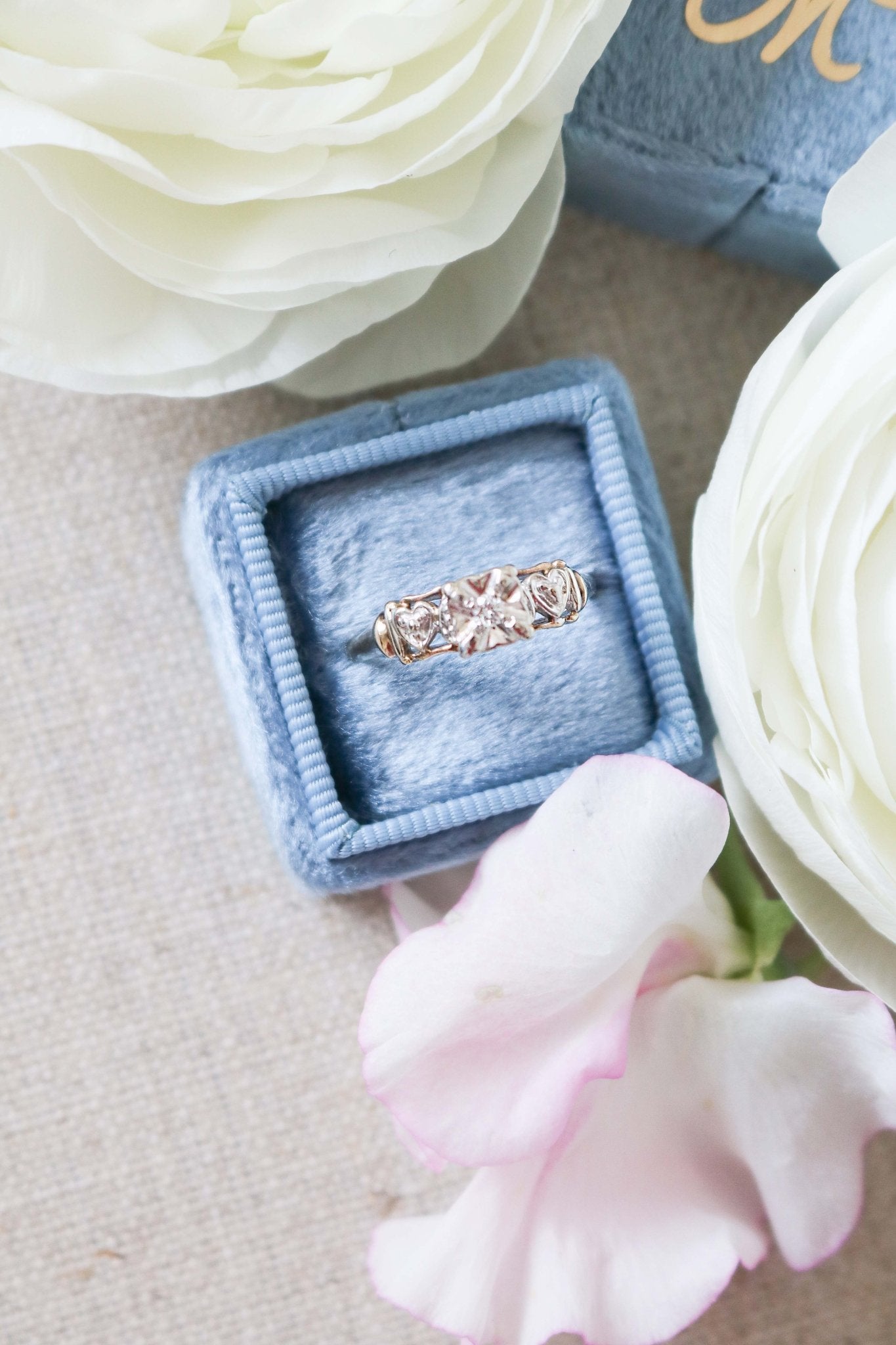 Top view of Yellow and White Gold Vintage Engagement Ring with Diamond Hearts on top of ring box. Antique Engagement Rings Canada. Canadian vintage engagement rings. Vintage engagement rings Canada. Bridal jewelry Canada. Canadian weddings. Wedding Canada. Canadian bridal jewelry. Woman-owned Canadian jewelry brand. Canadian jewelry business.