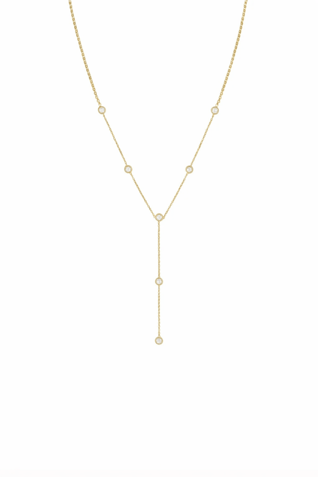 Gold lariat style necklace with cubic zirconia crystals on a white background