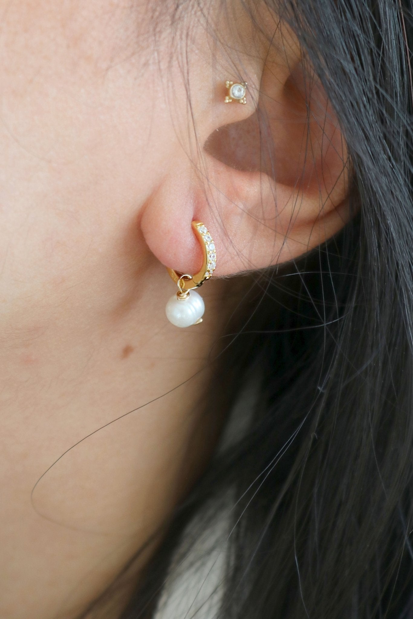 Gold-filled huggies with inset cubic zirconia and freshwater pearl dangle. Canadian jewelry designs. Bridal jewelry Canada. Pearl jewelry Canada. Pearl Bridal jewelry Canada. Gold-filled jewelry Canada. Organic pearl jewelry. Canadian bridal jewelry.