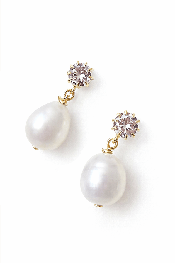 Freshwater pearl stud earrings with crystals on a white background perfect for bridesmaids and Canadian weddings. Pearl earrings, bridesmaid earrings, & Canadian bridal jewelry handmade by Canadian BIPOC bridal designer