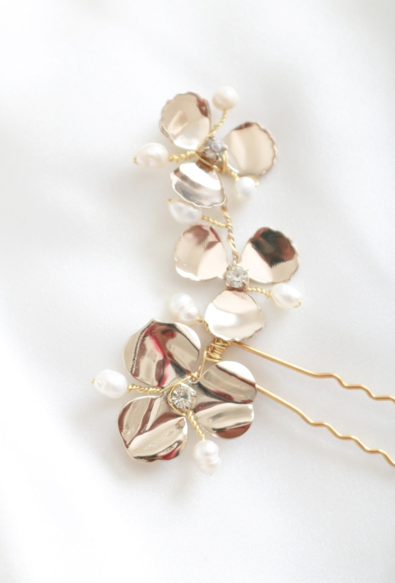 A single Posey Flower Bridal Hairpin with Fresh Water Pearls on a white background. Bridal Hair Accessories. Bridal Accessories. Canadian Bridal Accessories. Handmade Canadian Accessories. Canadian handmade Accessories. Canadian weddings. Wedding Canada. Organic pearl accessories. Pearl Bridal Hair Accessories. Pearl Bridal Accessories.