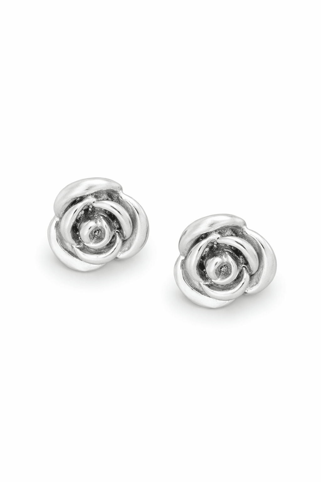 Pair of silver rose-shaped stud earrings on a white background. Sterling silver jewelry, silver earrings, & handmade jewelry Canada