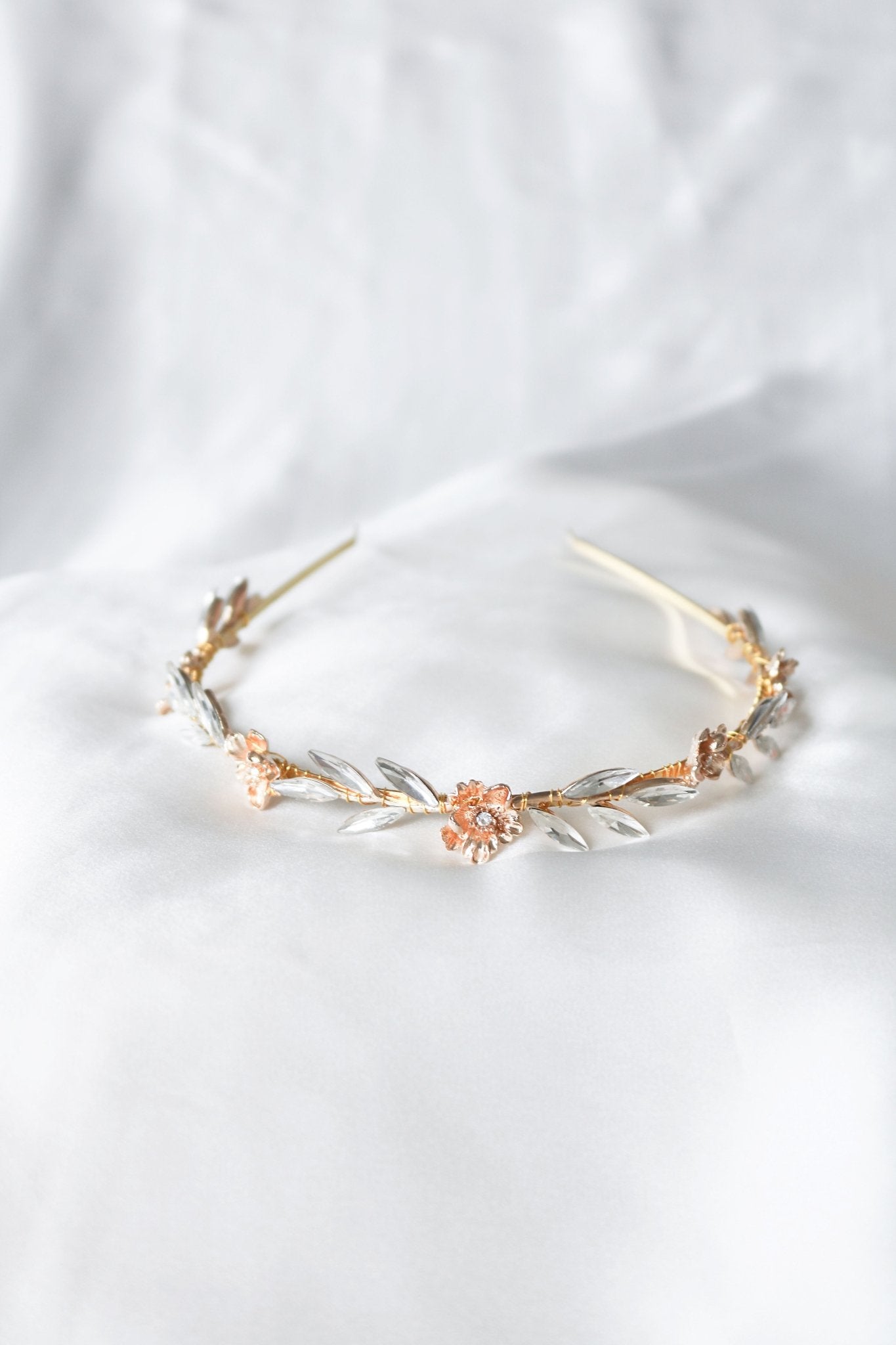 Full photo of the Rosalie Bridal Headband with crystal leaves and gold roses on a white backdrop. Bridal Hair Accessories. Bridal Accessories. Canadian Bridal Accessories. Handmade Canadian Accessories. Canadian handmade Accessories. Organic pearl accessories. Canadian weddings. Wedding Canada.