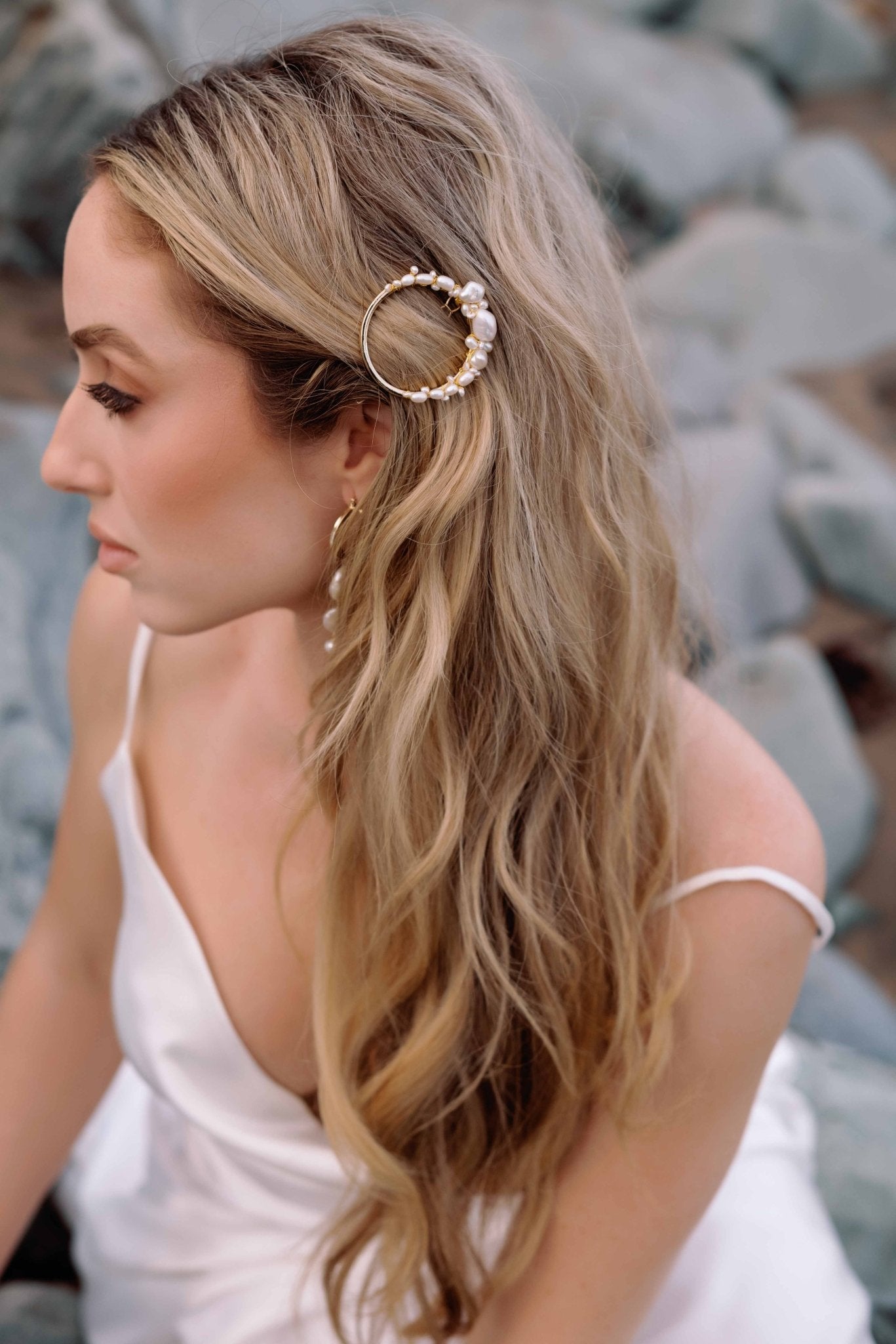 Seaside bride holds hair with a circular pearl adorned barrette. Organic pearl accessories. Pearl Bridal Hair Accessories. Pearl Bridal Accessories. Bridal Hair Accessories. Bridal Accessories. Canadian Bridal Accessories. Handmade Canadian Accessories. Canadian handmade Accessories. Canadian weddings. Wedding Canada.